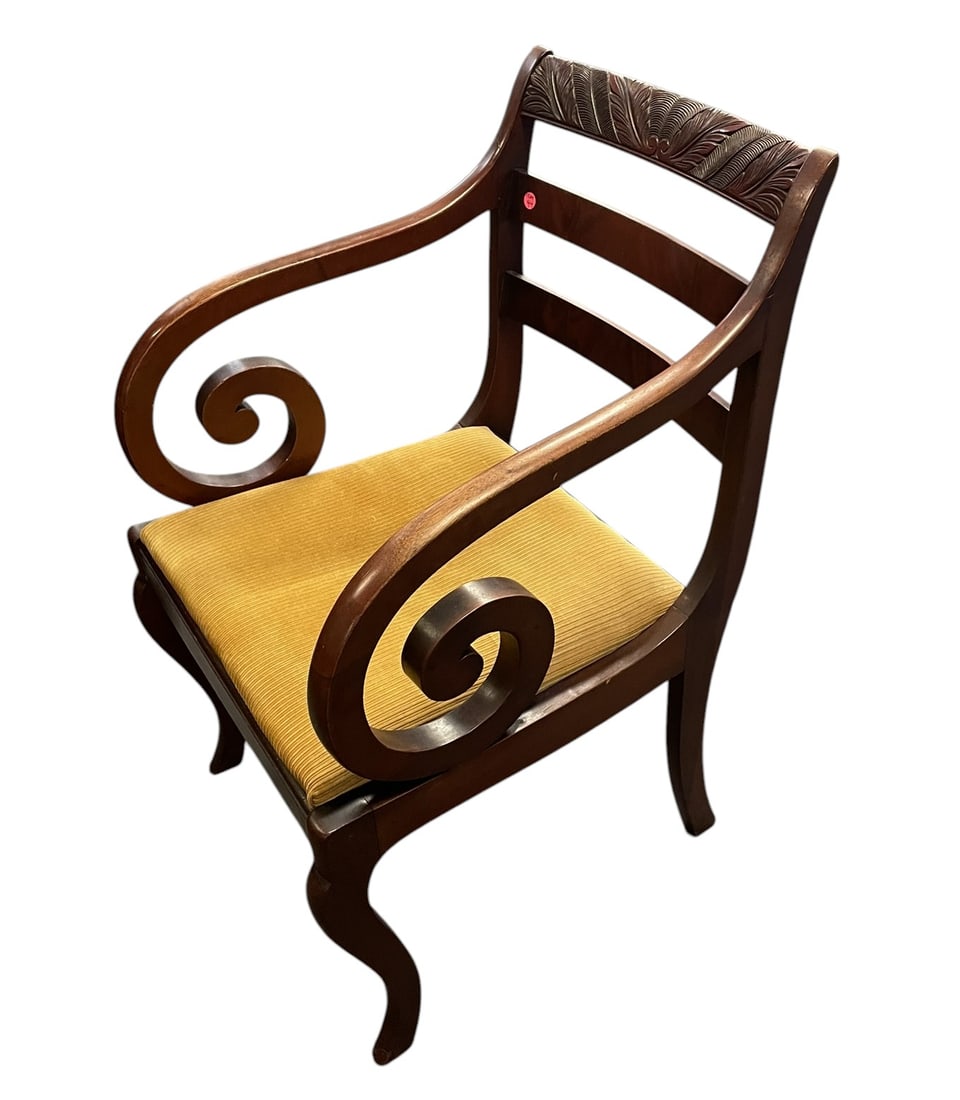 REGENCY STYLE CARVED MAHOGANY ARMCHAIR: Vintage English Regency Style Carved Mahogany Armchair. Carved Crest Rail and Scrolling Ram orn Arms. Measures 21"x21"x34 tall. **In house shipping available on this lot** If you win this lot, please 