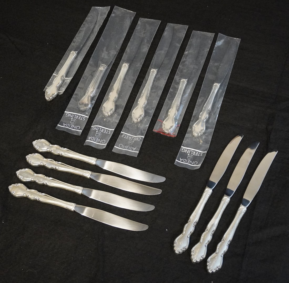 12 STERLING HANDLE DOVER PATTERN DINNER KNIVES: Twelve (12) Oneida Modern Hollow Knife in the Dover Pattern. Sterling Handles, Stainless Blades. Each 9". Weight 2 lbs. **In house shipping available on this lot** If you win this lot, please select s