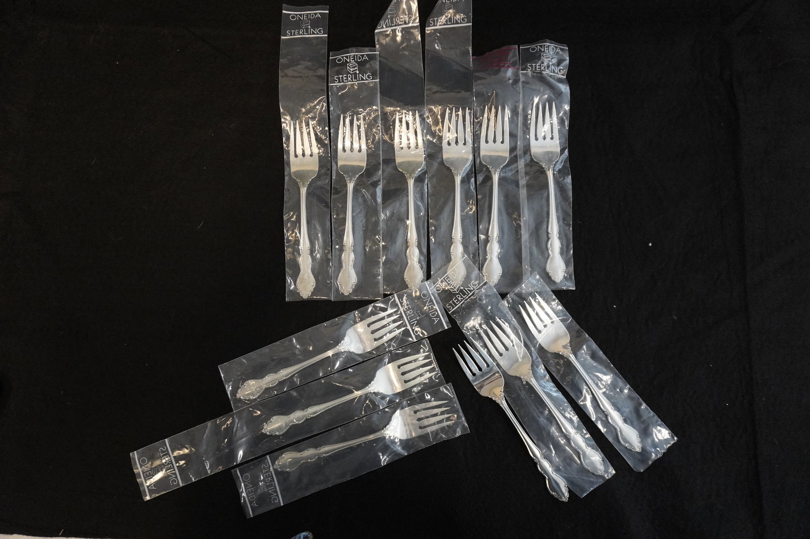 12 STERLING SILVER DOVER SALAD FORKS UNUSED: Twelve (12) Vintage Heirloom Sterling Silver "Dover" Pattern Salad Forks by Oneida. Each 6 3/4". Still in the original packaging. Excellent condition, never used. Approximate silver weight 488 grams. 
