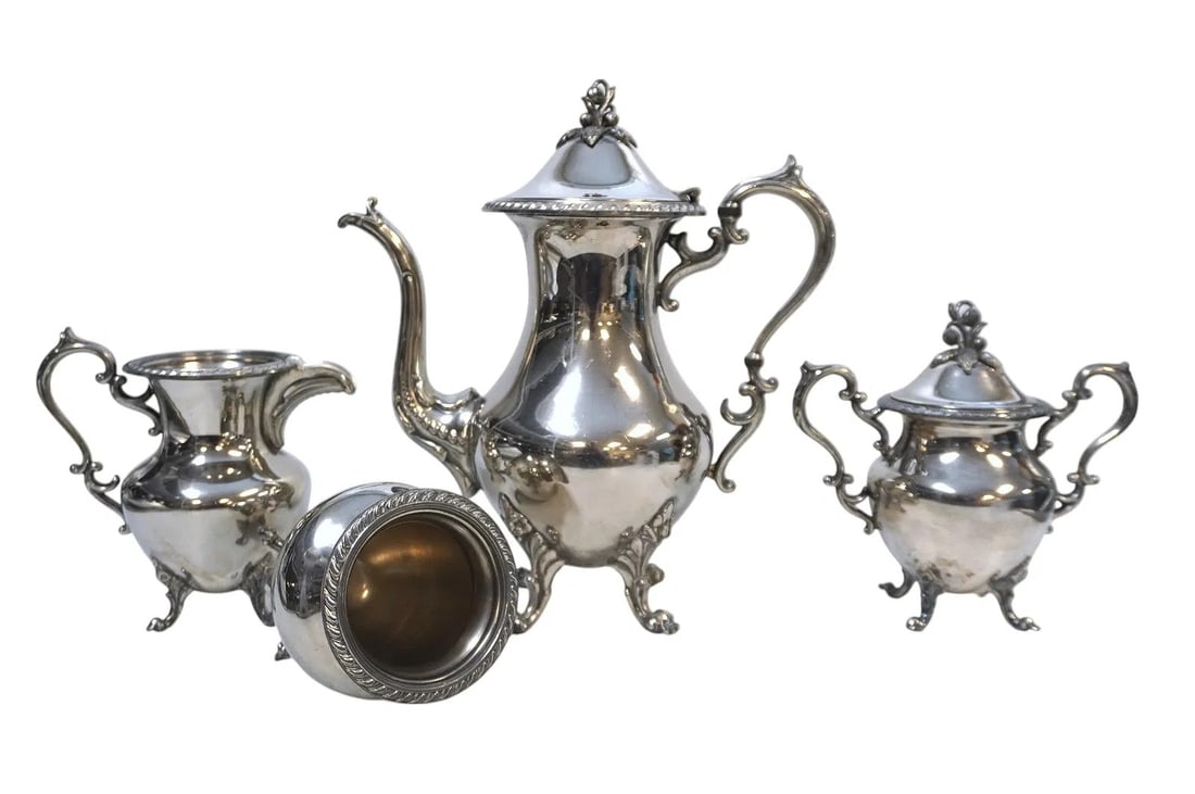 4 PC COFFEE SERVICE GOLDFEDER SILVER CO: 4 Piece Silver on Copper Coffee Service by Goldfeder Silver Co. of Connecticut. Coffee Pot 11 1/2" tall. Sugar and Creamer 7". Waste 5". Weight on all 8 lbs 5 oz.