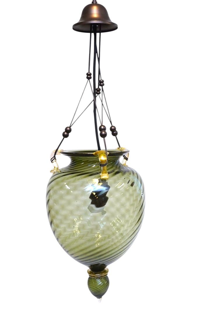 OGGETTI MURANO BLOWN GLASS PENDANT LIGHT: Contemporary Oggetti Mouth Blown Murano Pendant Light in Green with Gold Aventurine Accents. Pendant 9"x9"x17". 29" including cap. Weight 6 lbs. **In house shipping available on this lot** If you win 