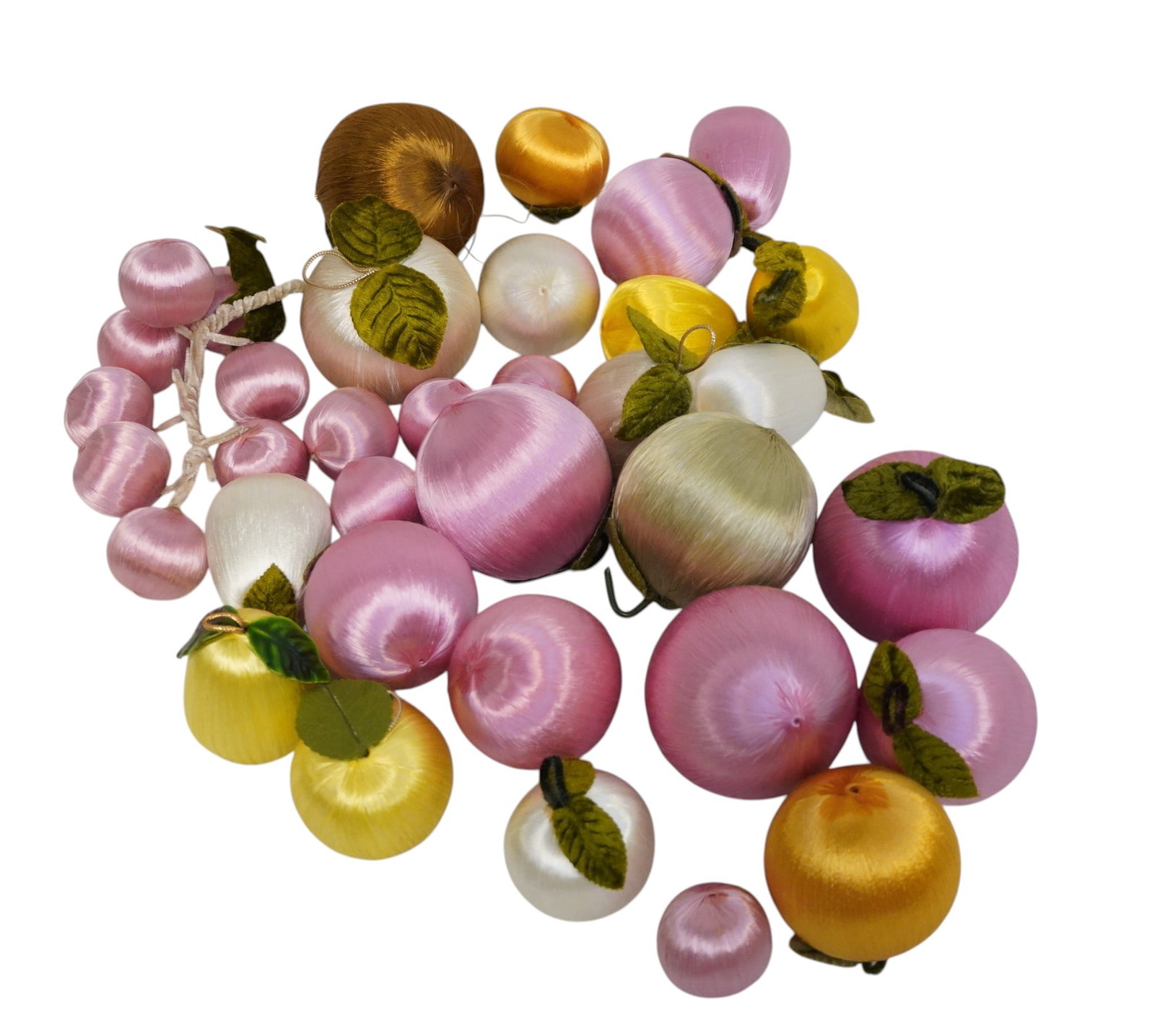 28 VINTAGE SATIN WRAPPED FRUIT ORNAMENTS/DECOR: 28 Vintage Satin Wrapped Fruit Ornaments/Decor. Largest measures approx. 3" x 3" in dia. and weighs 7.6 oz. **In house shipping available on this lot** If you win this lot, please select self