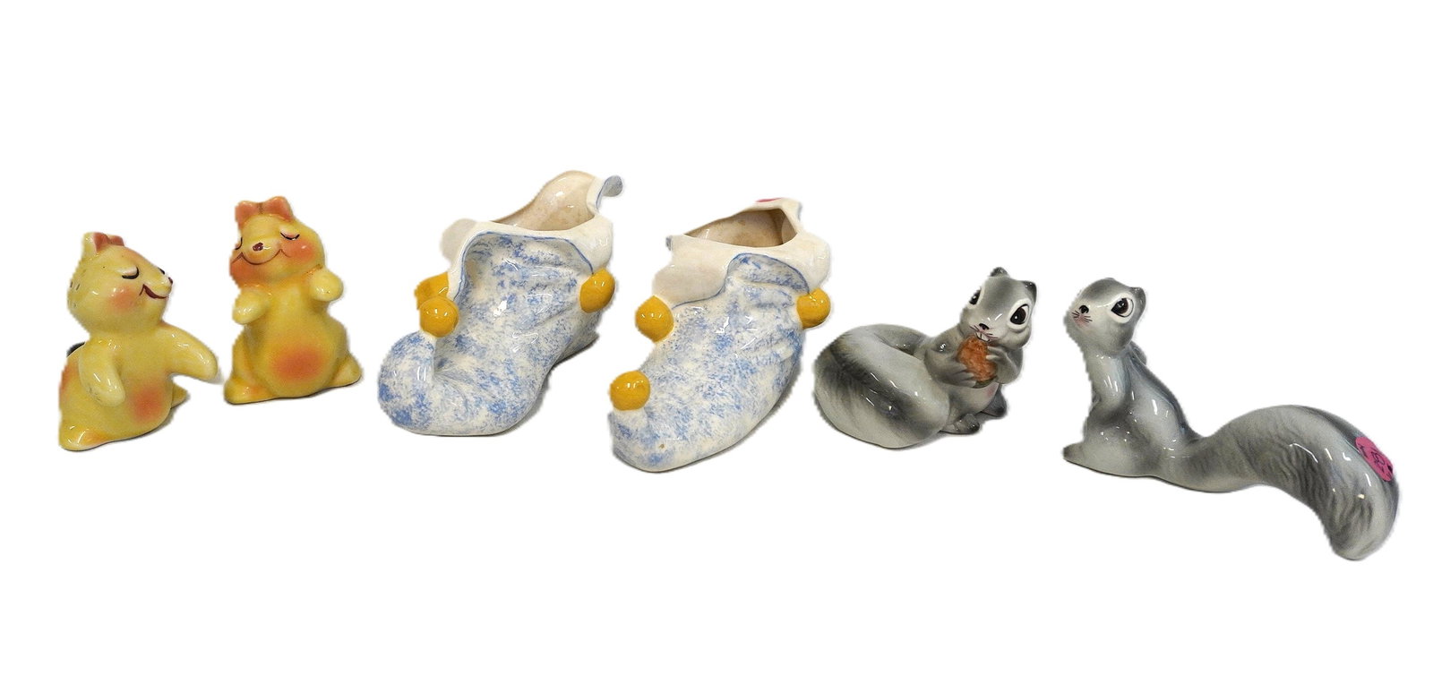 6 KITSCHY MCM PORCELAIN PIECES: 6 Kitschy MCM Porcelain Pieces. Largest pieces are jester shoe planters which measure approx. 7" x 3" x 3.5", total lot weight approx. 1 lb 15 oz. **In house shipping available on this lot** If you wi
