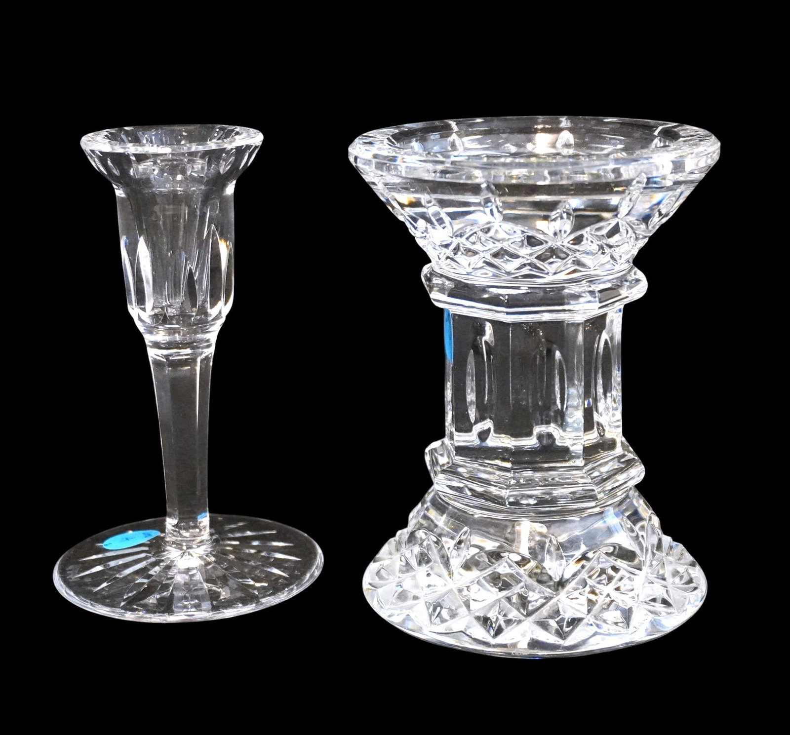 WATERFORD LISMORE CRYSTAL PILLAR CANDLESTICK AND TALL CANDLESTICK HOLDER: Waterford Lismore Crysta Pillar Candlestick which measures approx. 5.5" x 4.25" in dia. and Lismore Tall Candlestick holder which measures approx. 5.25" x 3.25" in dia. Total lot weight is 4 lbs 3 oz.