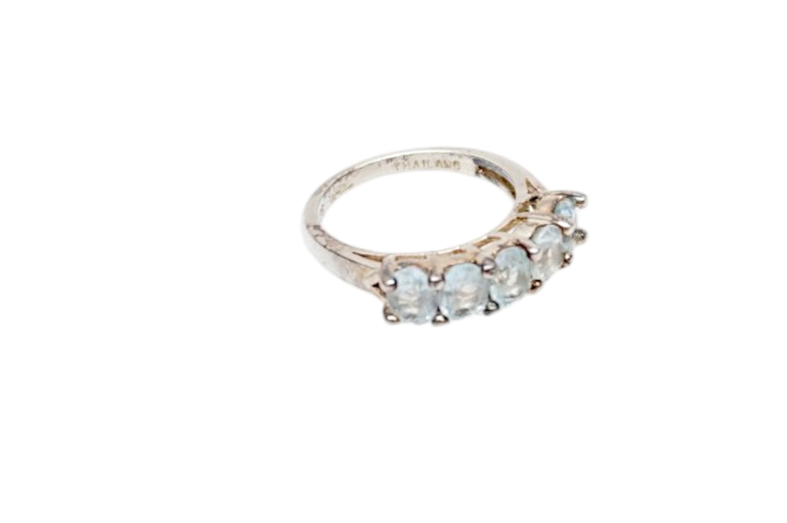 STERLING SILVER PALE BLUE TOPAZ LADIES RING SZ 5.25: Sterling Silver Half Eternity Band with 5 Pale Blue Topaz Stones. Sz 5.25. Approx weight 3 grams **In house shipping available on this lot** If you win this lot, please select self arranged for in hou