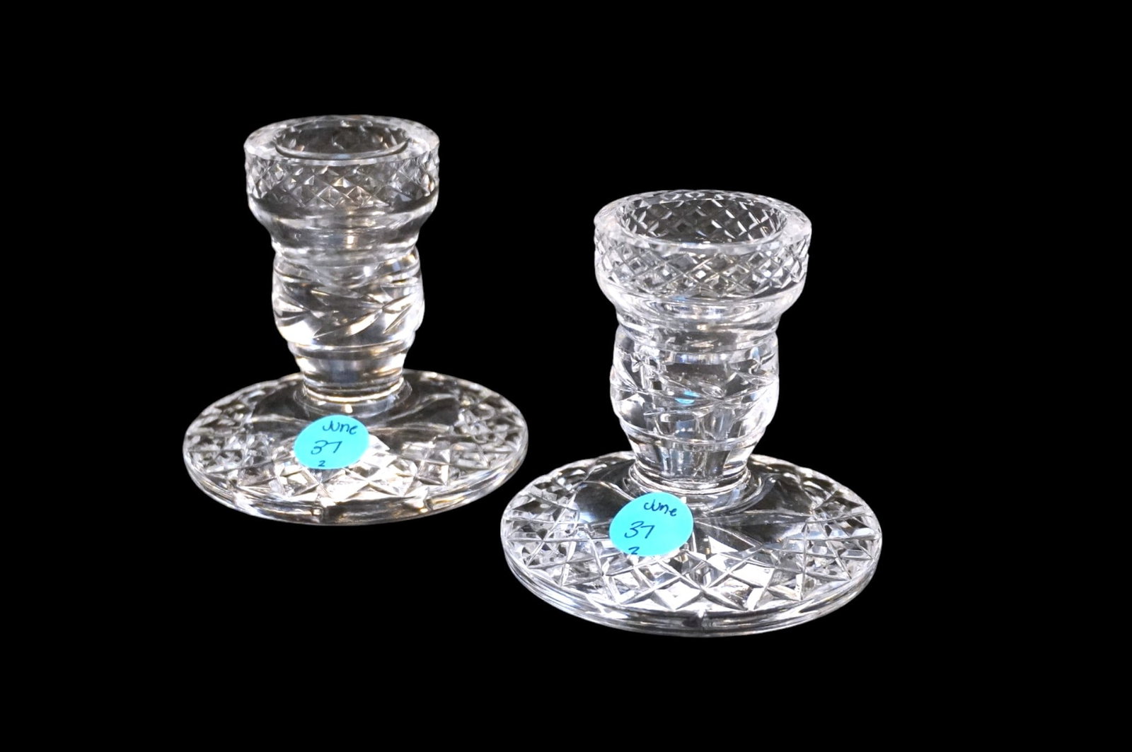PAIR OF WATERFORD GLANDORE CRYSTAL CANDLESTICKS: Pair of Waterford Glandore Crystal Candlesticks. Each measures approx. 3.5" x 3.5" in dia and weighs 1 lb 12 oz. **In house shipping available on this lot** If you win this lot, please select self arr