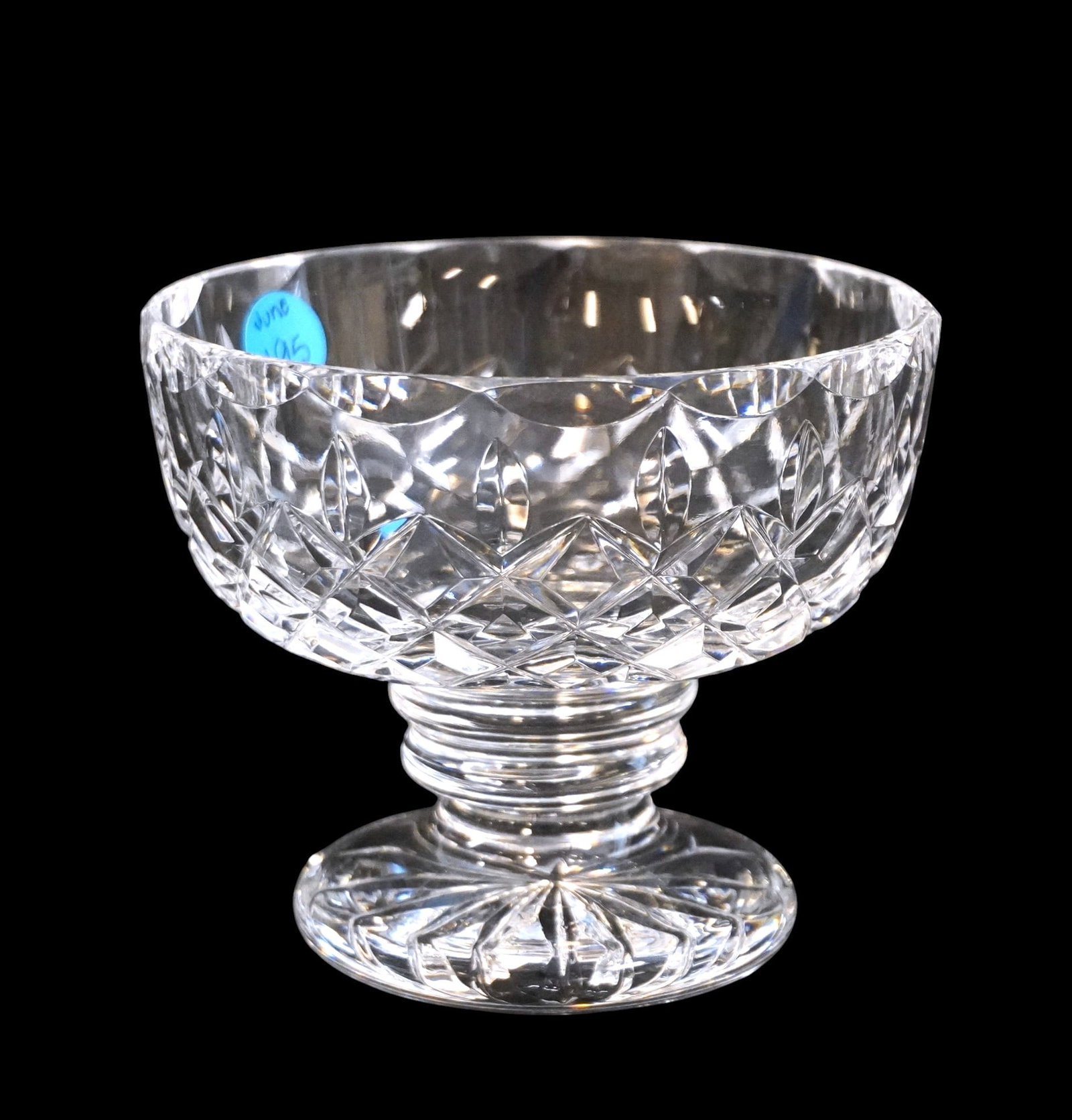 WATERFORD LISMORE CRYSTAL FOOTED BOWL: Waterford Lismore Crystal Footed Bowl. Measures approx. 4.25" x 5" in dia. and weighs 1 lb 12 oz. **In house shipping available on this lot** If you win this lot, please select self arranged for in ho