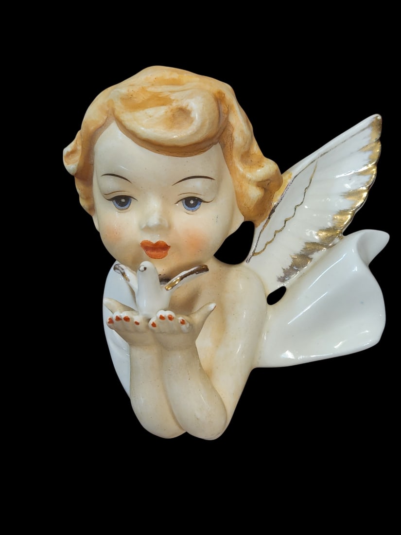 MID CENTURY PORCELAIN CHERUB WITH DOVE FOR WALL: Mid Century 1950-60 Porcelain Cherub / Angel holding a dove, wall mount. Measures 4 3/4"x4 1/4"x2 1/4". Weight 5 oz. **In house shipping available on this lot** If you win this lot, please select self