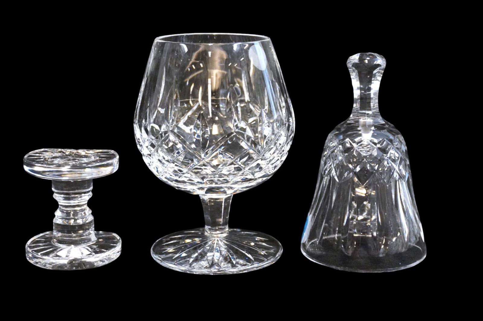 3 PIECES OF VINTAGE WATERFORD CRYSTAL - GOBLET, BELL AND KNIFE REST: 3 Pieces of Vintage Waterford Crystal. includes Lismore Brandy Glass/Goblet, Lismore Bell and Knife Rest. Largest is glass which measures approx. 5.25 x 3.5" in dia. Total lot weight is 1 lb 14 oz.