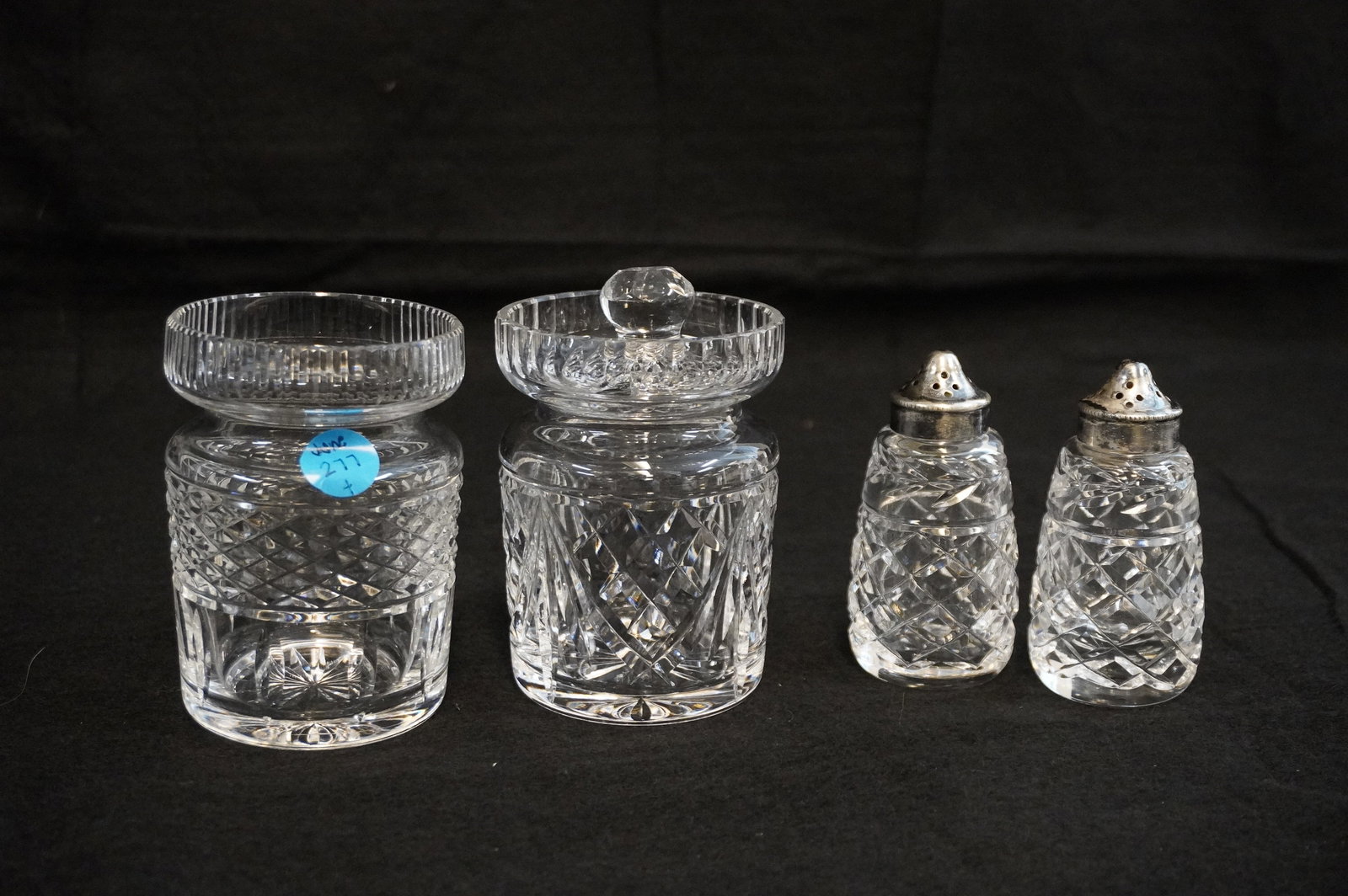 4 PIECES OF WATERFORD CRYSTAL - S&P SHAKERS AND JAM JARS: 4 Pieces of Waterford. Includes one Castlemain and one Lismore Jam Jar both measure approx. 5" x 3" in dia. and a pair of Glandore S&P Shakers which each measure approx. 4" x 1.5" in dia. Total lot we