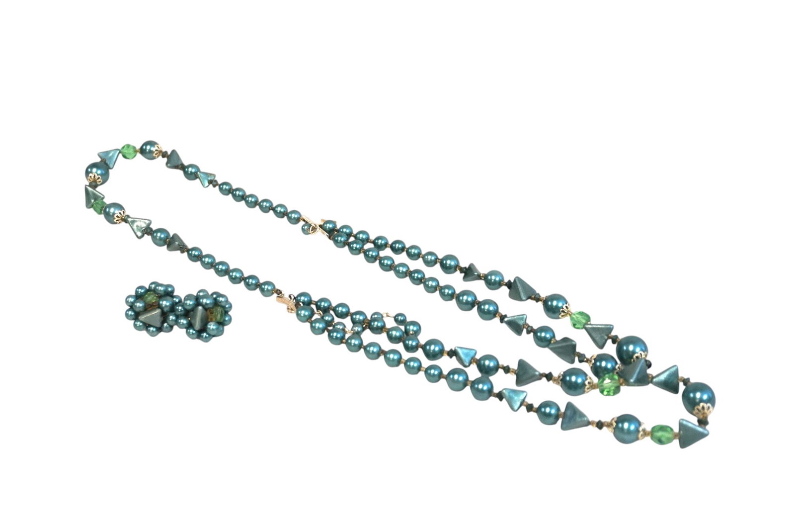 VINTAGE MID CENTURY COSTUME JEWELRY SET: Vintage Mid Century Costume Jewelry Set. Includes multi-strand necklace and pair of clip on earrings. Made in Japan. Necklace measures approx. 10.5" and earrings 1" in dia. Lot weight is 3 oz.**In hou