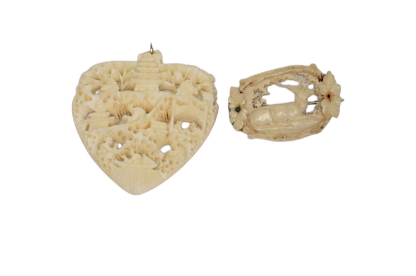 2 ANTIQUE CARVED BONE BROOCH & PENDANT: Delicate carved bone antique brooch and pendant. Victorian deer brooch 1 1/4". Carved Asian Heart pendant with figures and pagoda 2". Weight 1 oz **In house shipping available on this lot** If you win