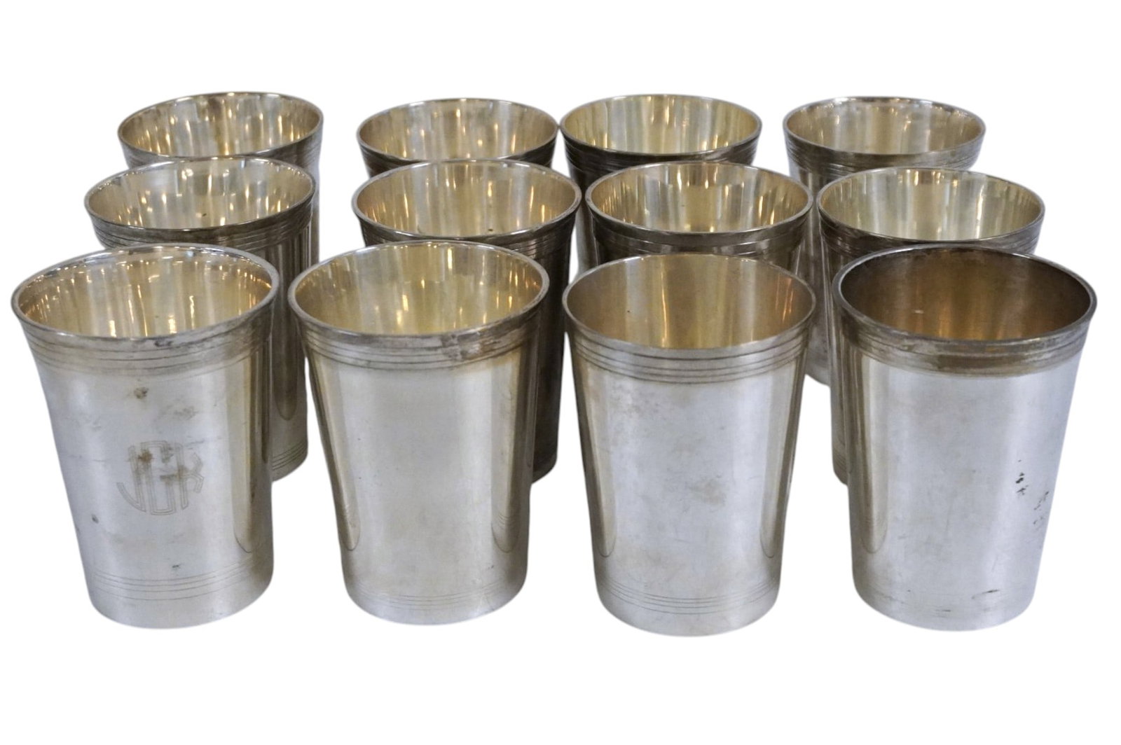 12 SILVER PLATED MINT JULEP CUPS: 12 Vintage Silver Plated Mint Julep Cups made in India. Monogrammed. Each 3"x3"x4". Weight on all 4 lbs 10 oz. PROVENANCE: The estate of noted Charleston Attorney, Scholar and Passionate Collector, Ja