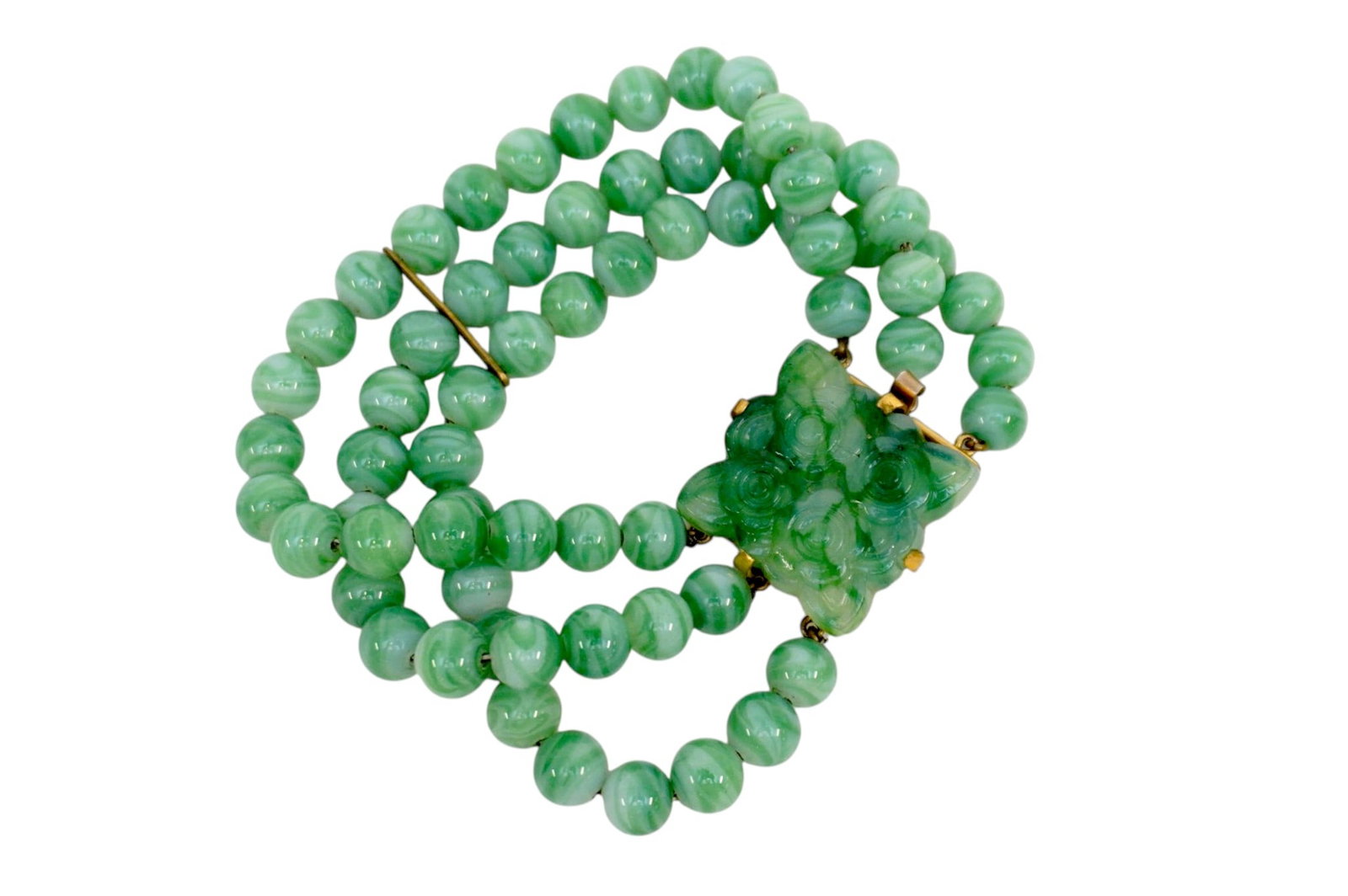 TRIPLE STRAND JADE JADEITE BRACELET W CARVED CLASP: Ladies Jadeite Bracelet. The bracelet consists of a triple strand of 66 Individually knotted Jadeite beads attached to a carved clasp on gold filled clasp. The 66 beads measure an average of 7.8mm in 