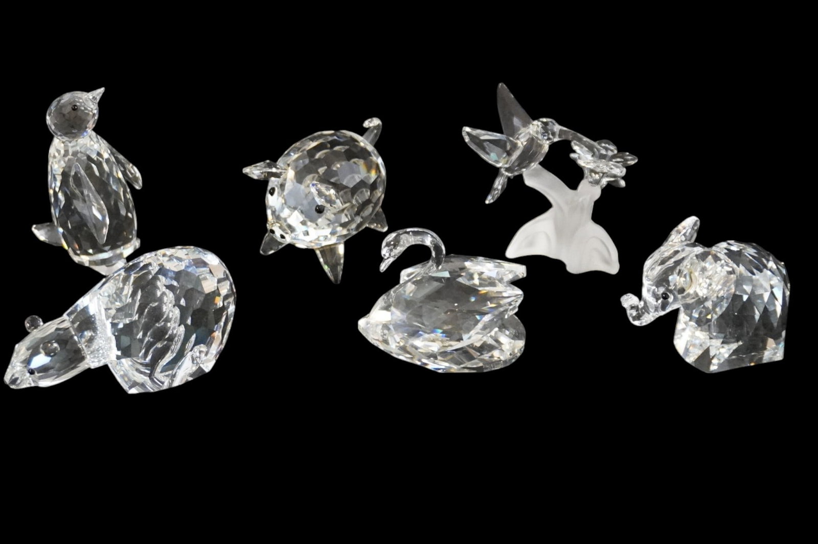 COLLECTION OF 6 VINTAGE SWAROVSKI CRYSTAL FIGURINES: Collection of 6 retired small Swarovski crystal figurines including: 1.) "Kingdom of Ice" Polar Bear 7649 2.) "Kingdom of Ice" Penguin 7643 3.) "Beauties of the Lake" Swan Figurine 7633 4.) Hummingbir
