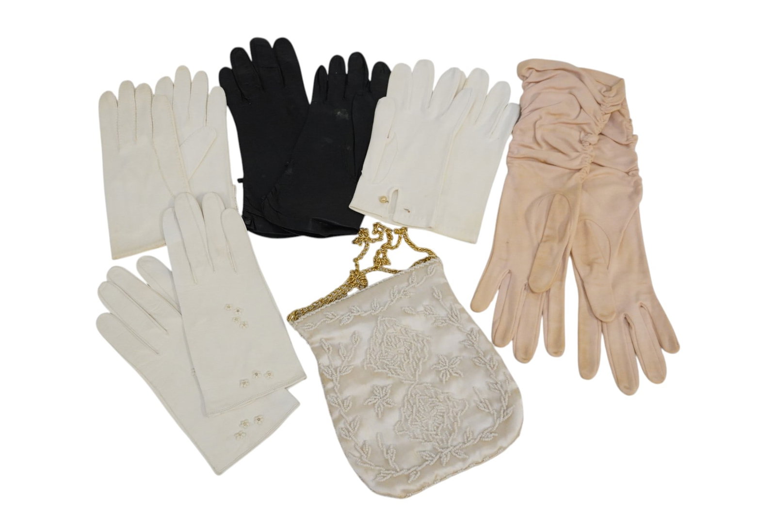 5 PAIRS OF VINTAGE LADIES LEATHER AND CLOTH GLOVES AND HAND BEADED EVENING PURSE: 5 Pairs of Vintage Ladies Leather and Cloth Gloves and Hand Beaded Evening Purse. Purse is largest piece and measures approx 14.5" x 6.25", total lot weight is 10.5 oz.