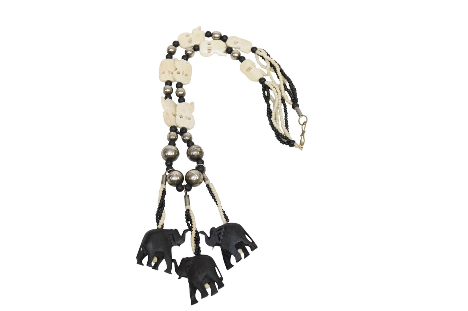LARGE VINTAGE BONE & EBONY ELEPHANTS NECKLACE BOHO TRIBAL: Large Vintage 1980s Carved Bone and Ebony Elephants Necklace. Carved Elephants with bone, ebony and silver beads. Measures open 23". Weight 4 oz. **In house shipping available on this lot** If you win