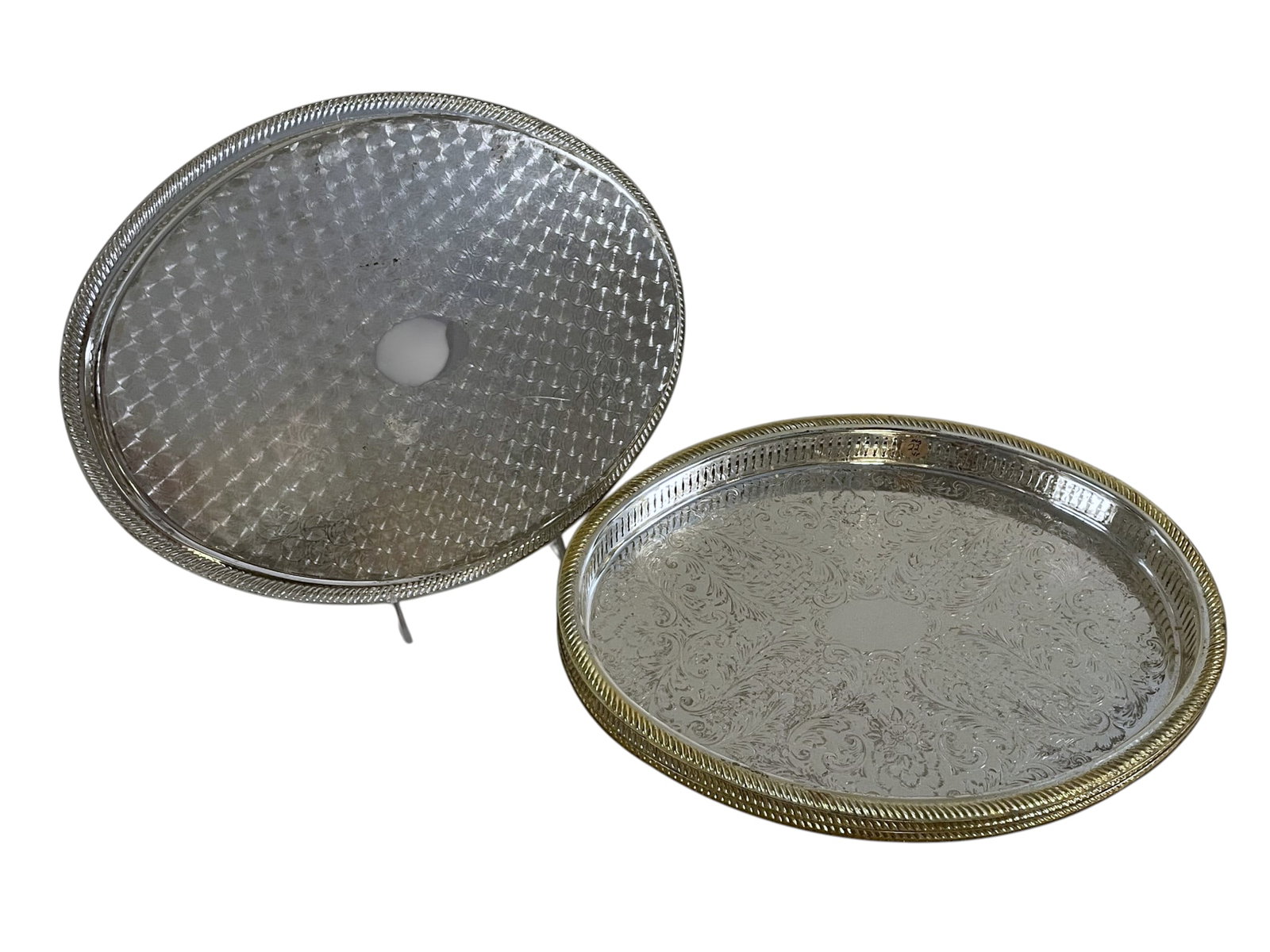 4 VINTAGE SILVER PLATED TRAYS WITH PIERCED GALLERY RIM: 4 Vintage Silver Plated Serving Trays with gold accented pierced gallery rims. Each 16 1/2"x13"x1 1/4". Weight on all 6 lbs 12 oz.. **In house shipping available on this lot** If you win this lot,