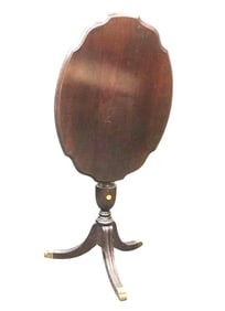 ANTIQUE MAHOGANY TILT TOP TEA TABLE ON BRASS PAW FEET