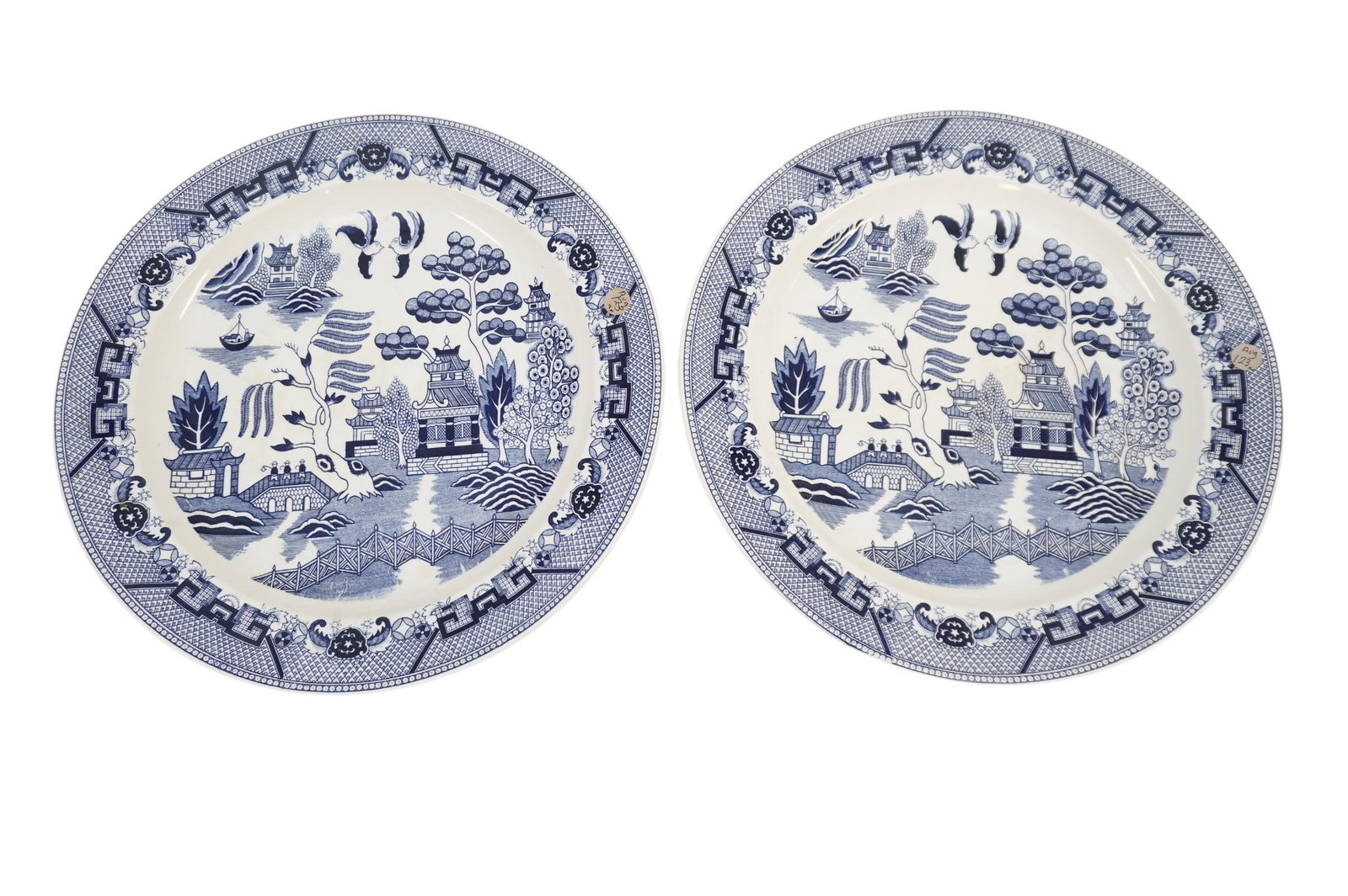 PAIR LARGE BLUE WILLOW JAPAN CHARGERS MID CENTURY: Pair Large Vintage Blue Willow Mid Century Japanese Chargers. Backs marked Japan. Each 16"x16"x1 1/2". Weight 9 lbs PROVENANCE: The Estate of Dr. Fraser Wilson, Charleston SC. Dr. Wilson will be remem