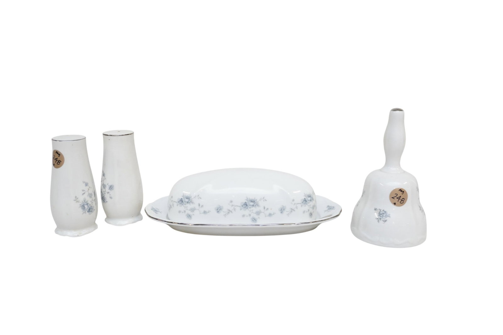 4 HAVILAND BLUE GARLAND CHINA PIECES: 4 Haviland Blue Garland China Pieces. Includes 1 covered butter dish, S&P Shakers, and Bell. Largest is butter dish which measures approx. 9" x 5" x 2", total lot weight is 1 lb 13 oz. **In house ship