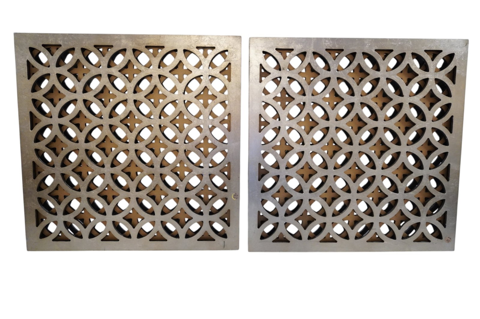 PAIR OF MIRRORED FRETWORK PANEL WALL DECORATIONS: Matched pair of decorative mirrored fretwork wall panels. Each 23 1/2"x23 1/2"x1 1/2". 27 lbs combined. **In house shipping available on this lot** If you win this lot, please select self arranged for
