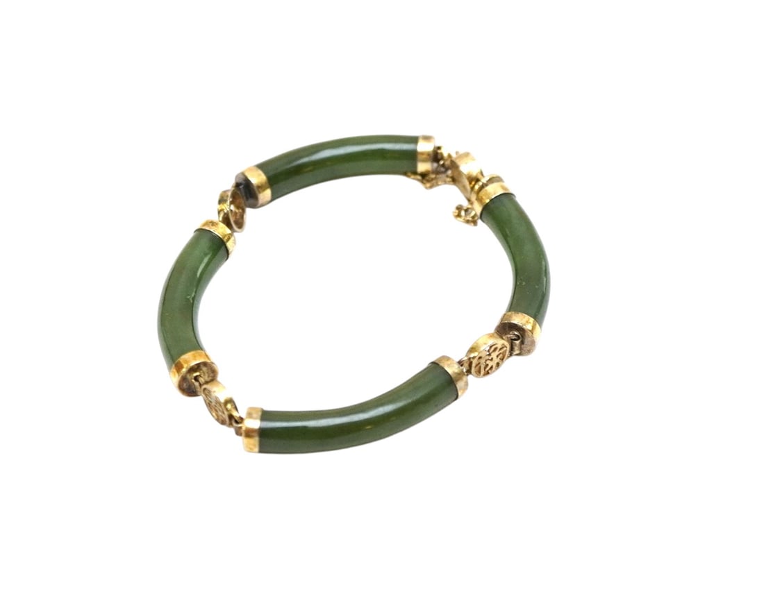 VINTAGE SPINICH GREEN JADE BRACELET: Vintage Chinese Spinich Green Jade Gilded Silver Bracelet with Shou Symbol Spacers. Shou represents longevity, health and good fortune. With safety clasp. Weight 18 grams. PROVENANCE: The Estate of Dr