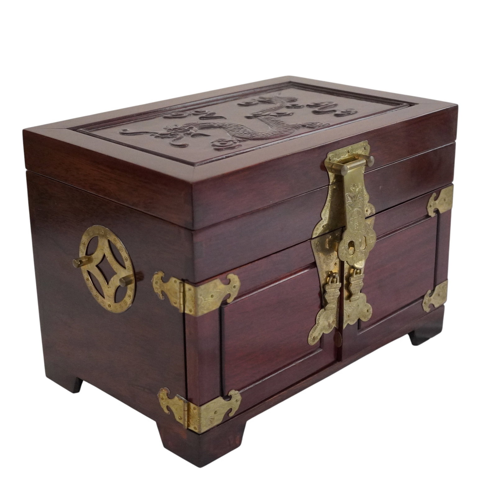 VINTAGE CARVED CHINESE ROSEWOOD JEWELRY BOX: Vintage Carved Chinese Rosewood Etched Brass Accented Jewelry Box. Lined in Padded Blue silk. Lift Top over 3 drawers.Measures 14"x9"x10". Weight 11 lbs **In house shipping available on this lot** If 