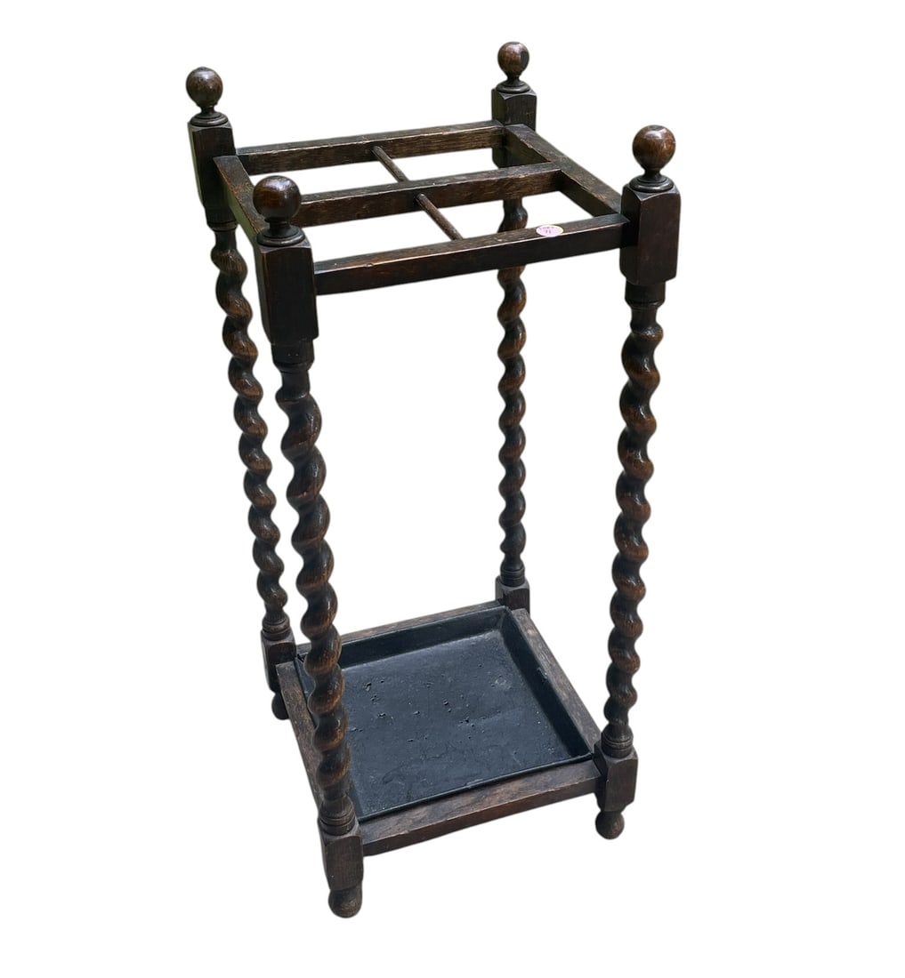 ANTIQUE ENGLISH OAK BARLEY TWIST UMBRELLA STAND: Antique English Oak Barley Twist Umbrella Stand. Original metal tray. Measures 13"x13"x30". Provenance:16 Water Street, a beautifully appointed home, circa 1815, located in the heart of the Charleston