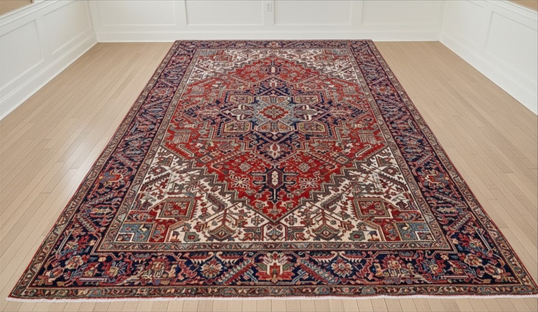 HAND KNOTTED SEMI ANTIQUE ROOM SIZE HERIZ SERAPI RUG: Room Size, Early 20th c, Hand Knotted Heriz Serapi Rug. Persia, geometric medallion pattern, red and navy. Provenance:16 Water Street, a beautifully appointed home, circa 1815, located in the heart