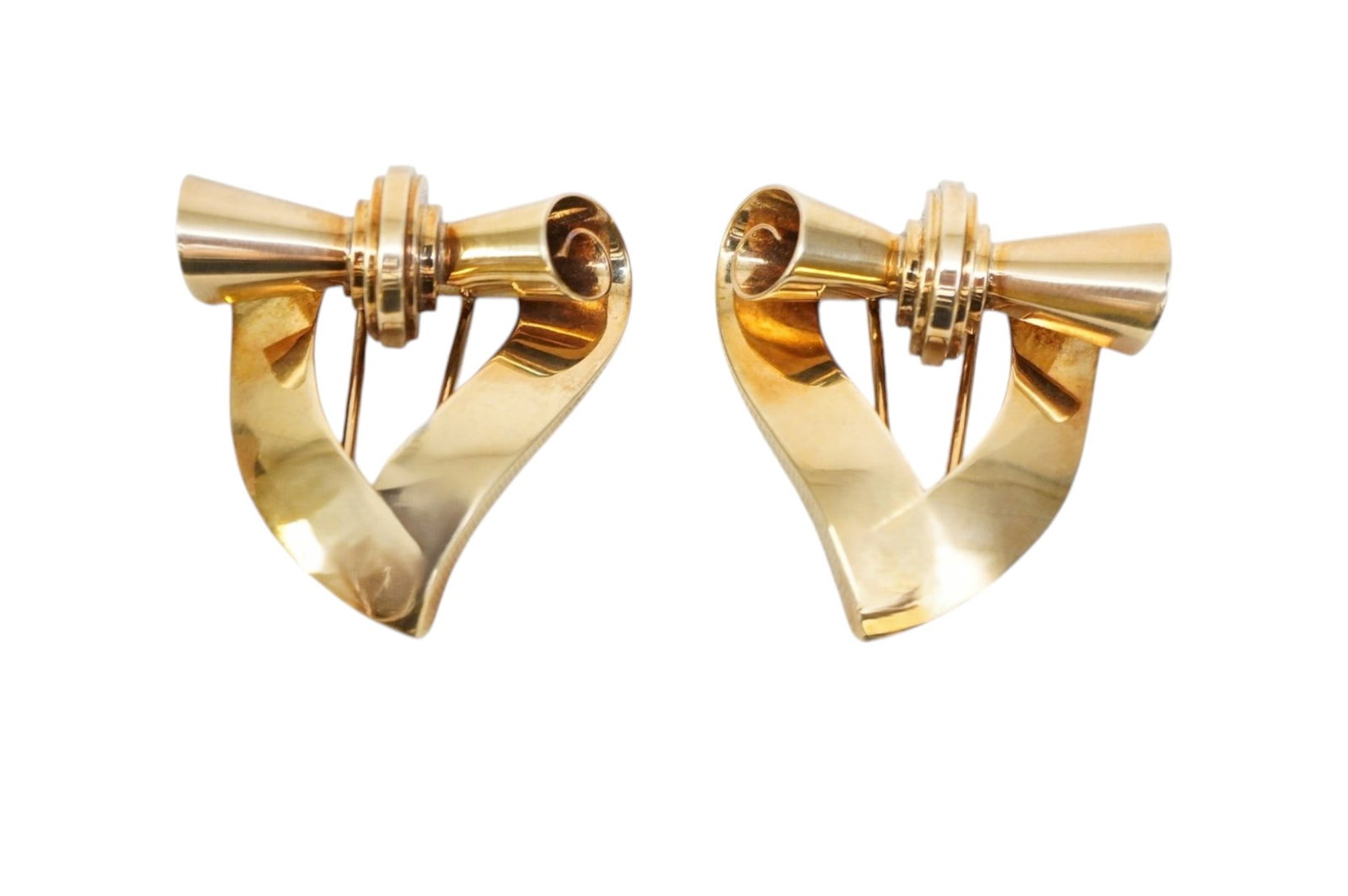 PAIR 14K GOLD RETRO SCROLLED FUR / DRESS CLIPS: Pair 14k Yellpw Gold Retro Mis Century Fur / Dress Clips. Measures 1 3/4"x1 1/2". Weight 27.16 grams. PROVENANCE: The Estate of Dr. Fraser Wilson, Charleston SC. Dr. Wilson will be remembered for his