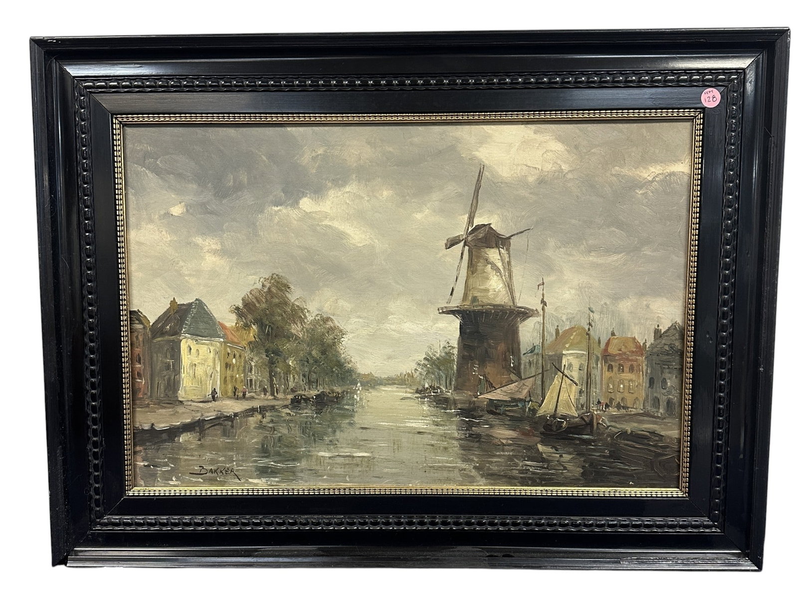 FRANS BAKKER (1871-1944) SIGNED OIL ON BOARD: An antique oil on board painting by Frans Bakker (Dutch, 1871-1944). This work depicts a waterside dutch village with sailboats and large windmill. It is signed on the lower left. Frans Bakker was a D