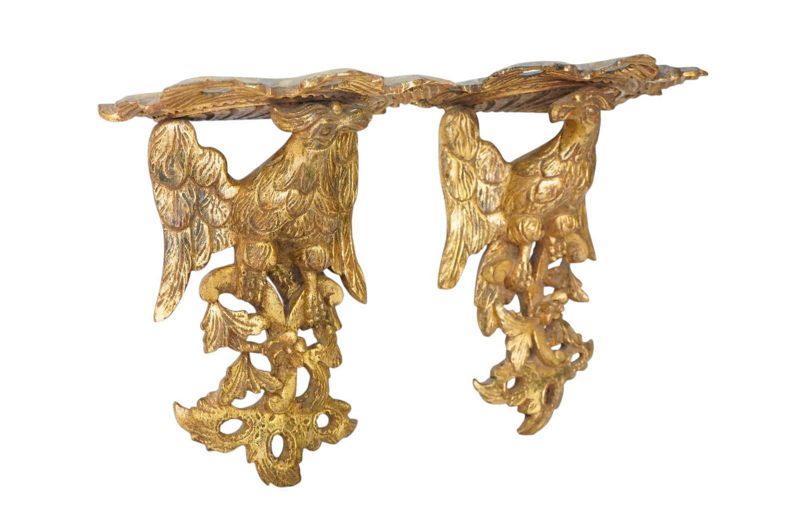PAIR OF ANTIQUE CARVED GILT WOOD EAGLE WALL BRACKETS: Pair of Antique Carved Gilt Wood Eagle Wall Brackets. Made to face each other. Each 10"x7"x13". Weight combined 4 lbs. PROVENANCE: The Estate of Dr. Fraser Wilson, Charleston SC. Dr. Wilson will be re