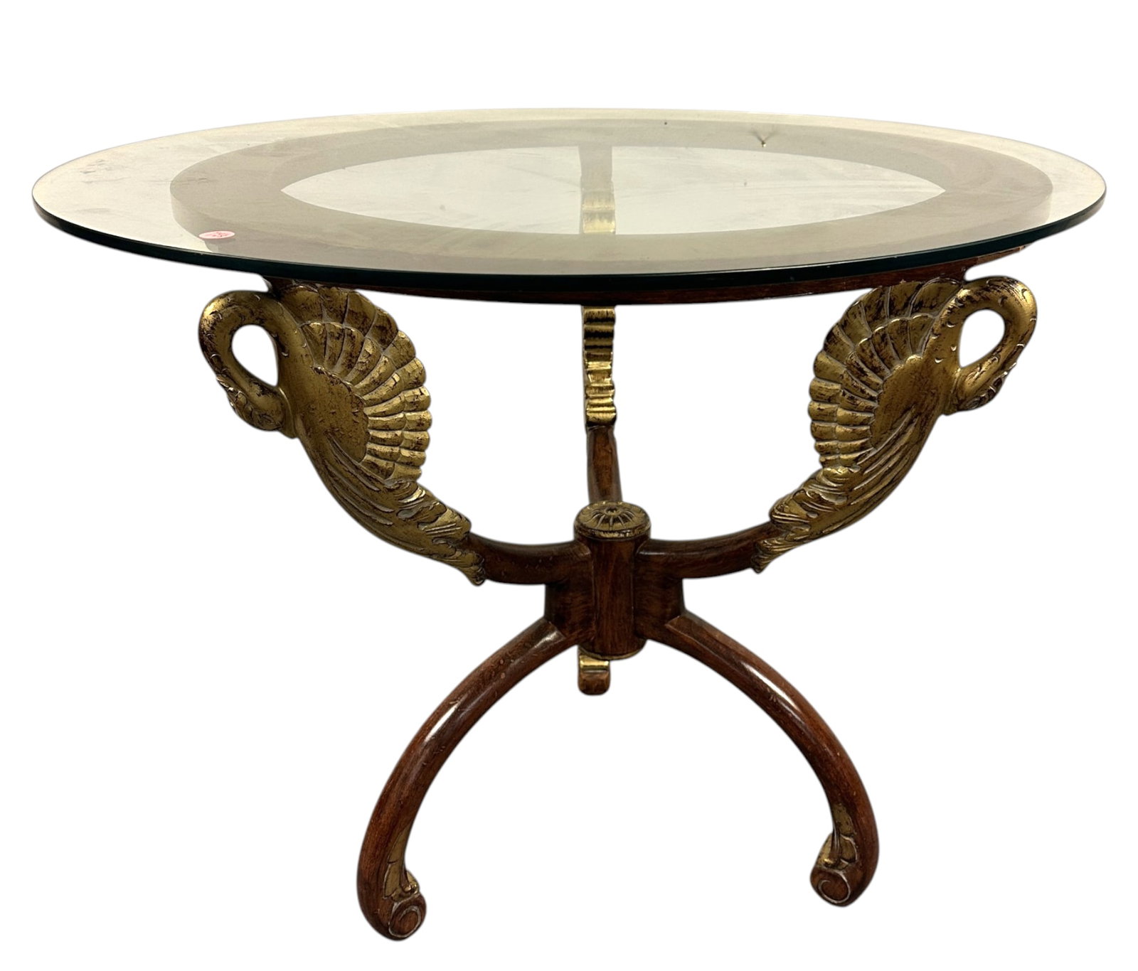 MAITLAND SMITH CARVED GILDED SWANS TABLE: Vintage Maitland Smith Carved & Gilt Swan Egyptian Revivial Glass Top Round Occasional / Coffee Table. Measures 32"x32"x26". **In house shipping available on this lot** If you win this lot, please