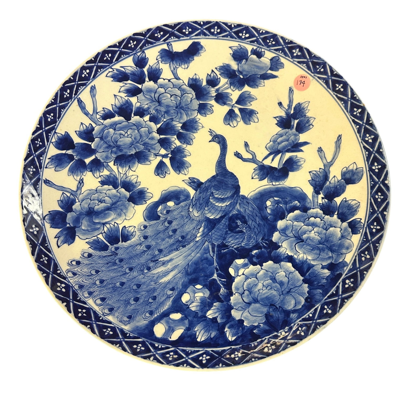 ANTIQUE LARGE JAPANESE BLUE AND WHITE IMARI PEACOCK PLATE: Antique Japanese Blue and White Imari Peacock Plate. Circa late 1800s - early 1900s. Signed on bottom. Measures approx. 15 3/4" in dia. and weighs 4 lbs 8 oz. Provenance: Gippy Plantation, Avenue of