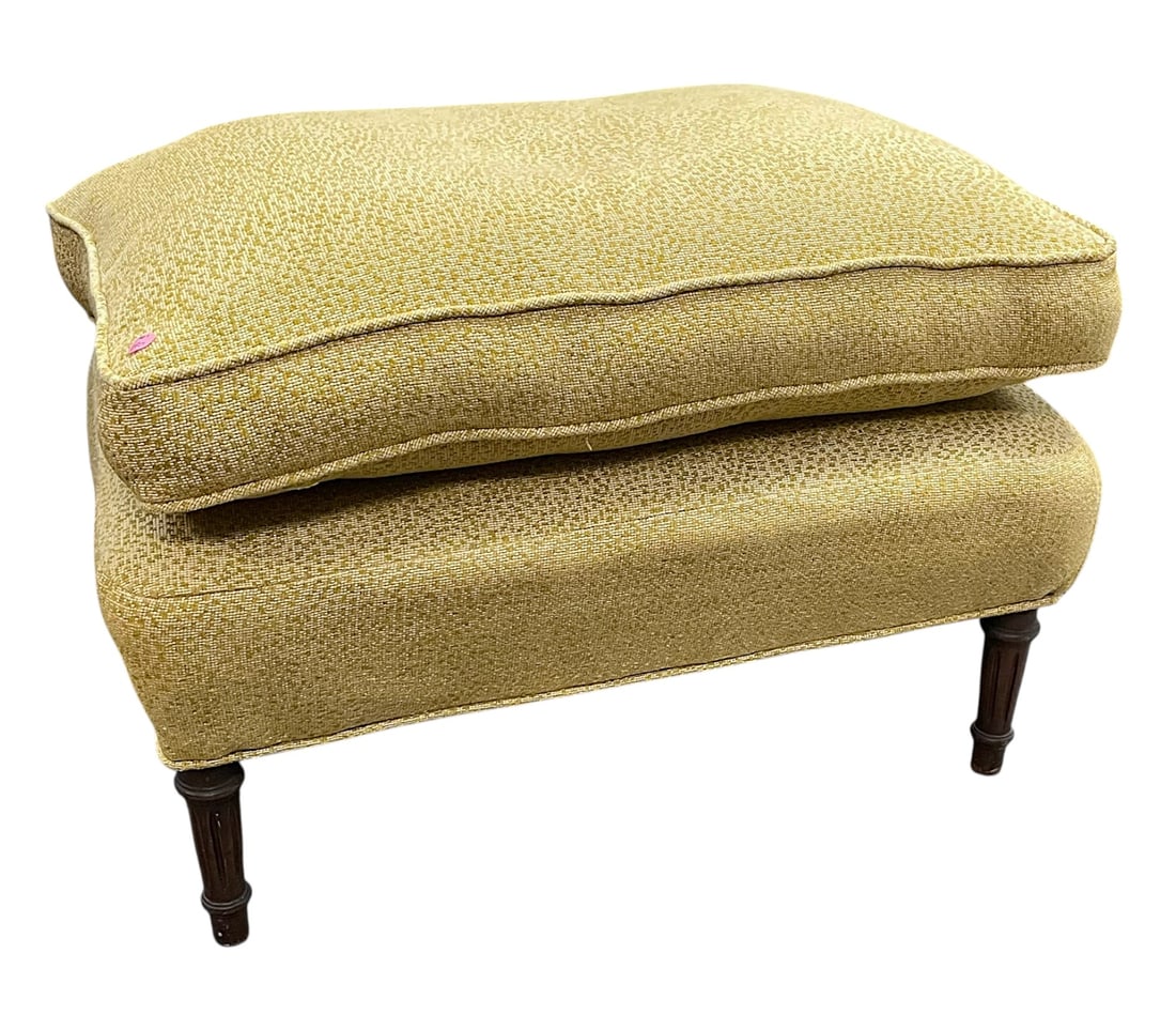 VINTAGE MID CENTURY OTTOMAN CUSHION TOP: Vintage Mid Century Soft Gold Yellow Reuphostered Ottoman with a Cushioned Top on Fluted Wood Legs. Measures 29" long x 20" deep x 20" high. Provenance:16 Water Street, a beautifully appointed home,
