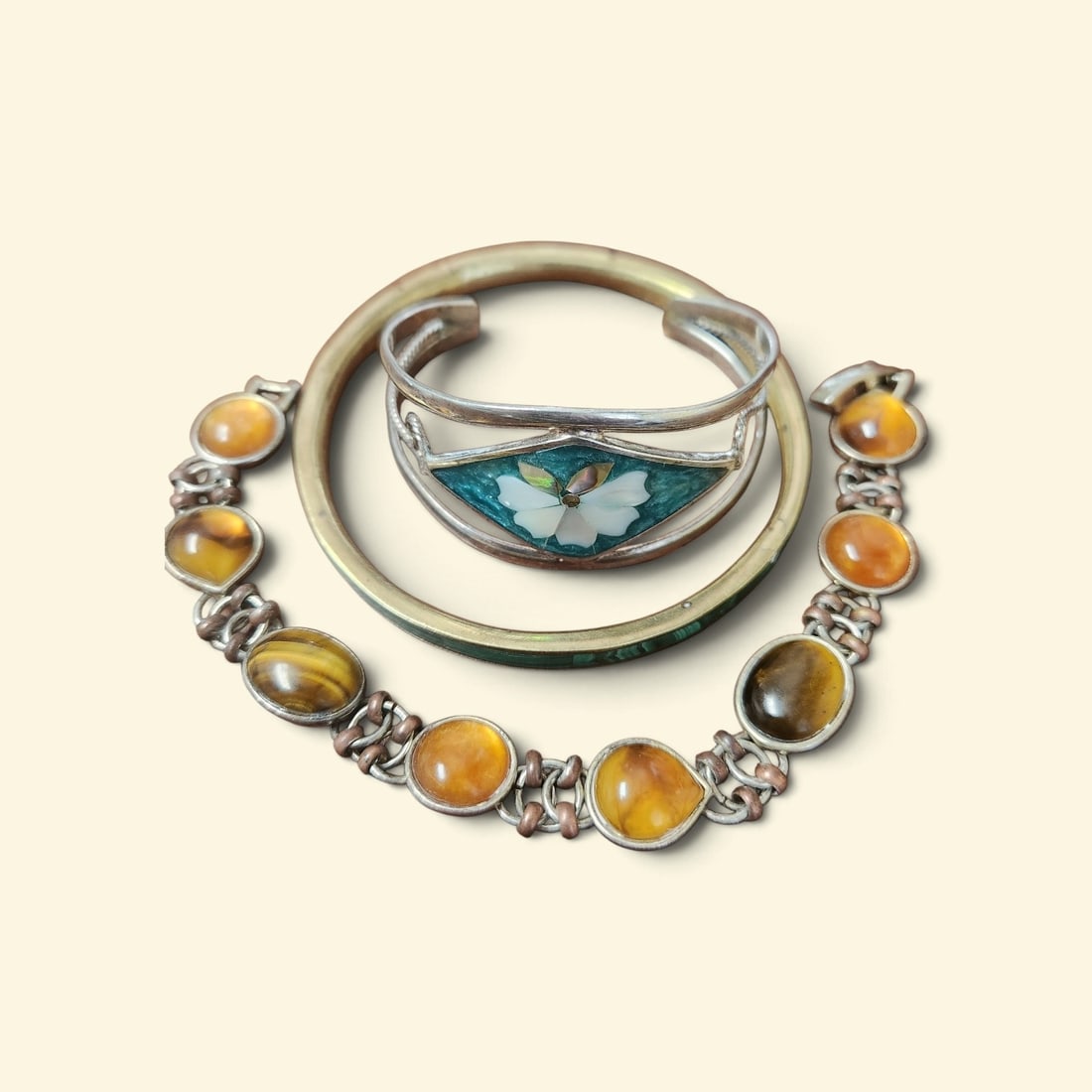 3 PC VINTAGE BRACELETS MALACHITE - MOP - AMBER - TIGERS EYE: 3 Vintage Bracelet / Bangles. Malachite Bangle openimg 2 1/2". Silver MOP and Quartz Cuff Bracelet Mexico 2" opening. Tiger Eye and Amber Copper Bracelet 7 1/4" opened . Weight on all 2 oz. **In