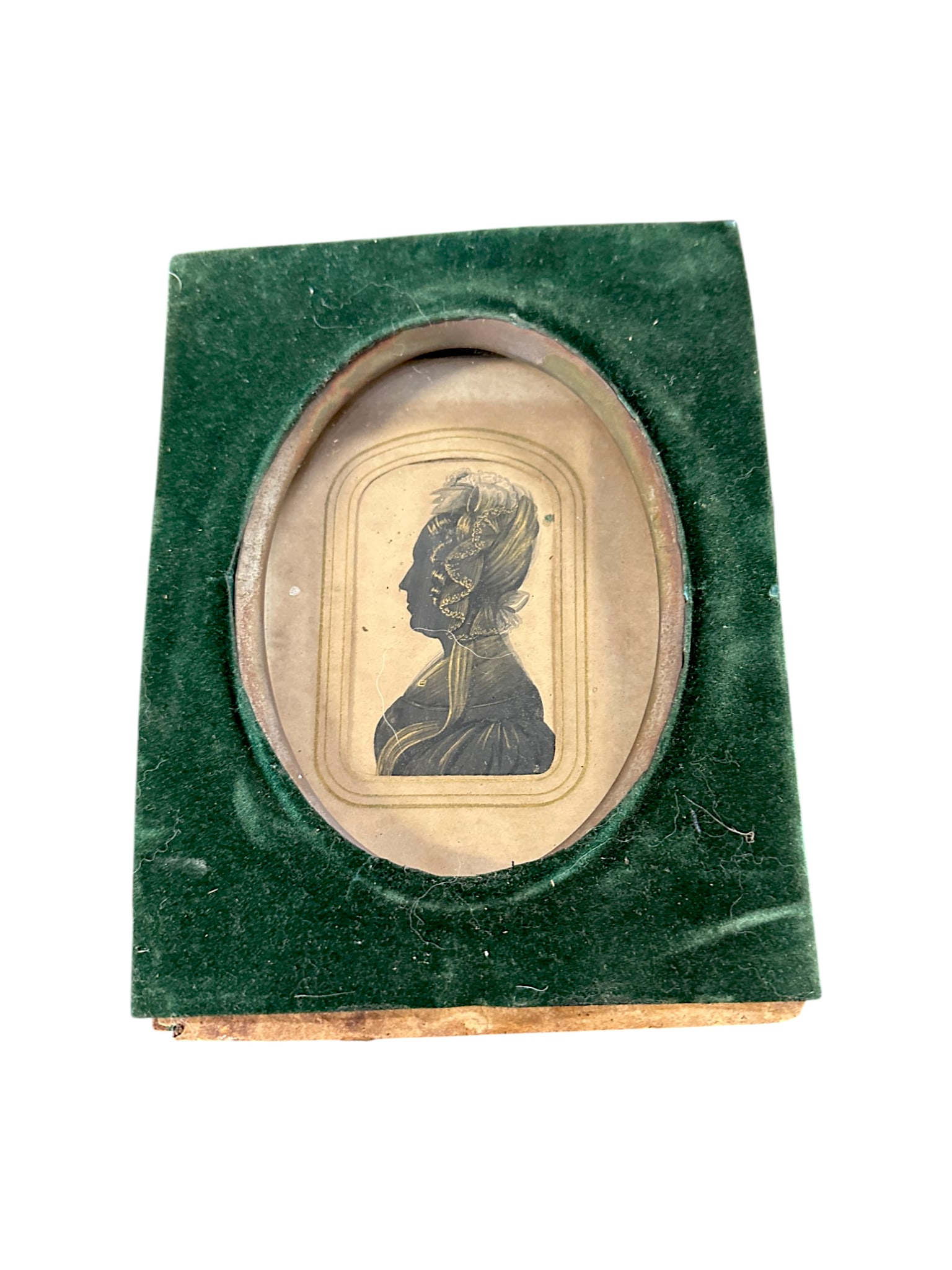 19TH C SILHOETTE PORTRAIT WITH GILT DETAILING: 19th c Silhoette Portrait of a Lady with hand painted gold gilt detailing c 1830-1850. .2"x3/1/4" silhoette frame 6"x7 3/4" Weight 7 oz. PROVENANCE:The Historic 1798 John Burckmeyer House, 120