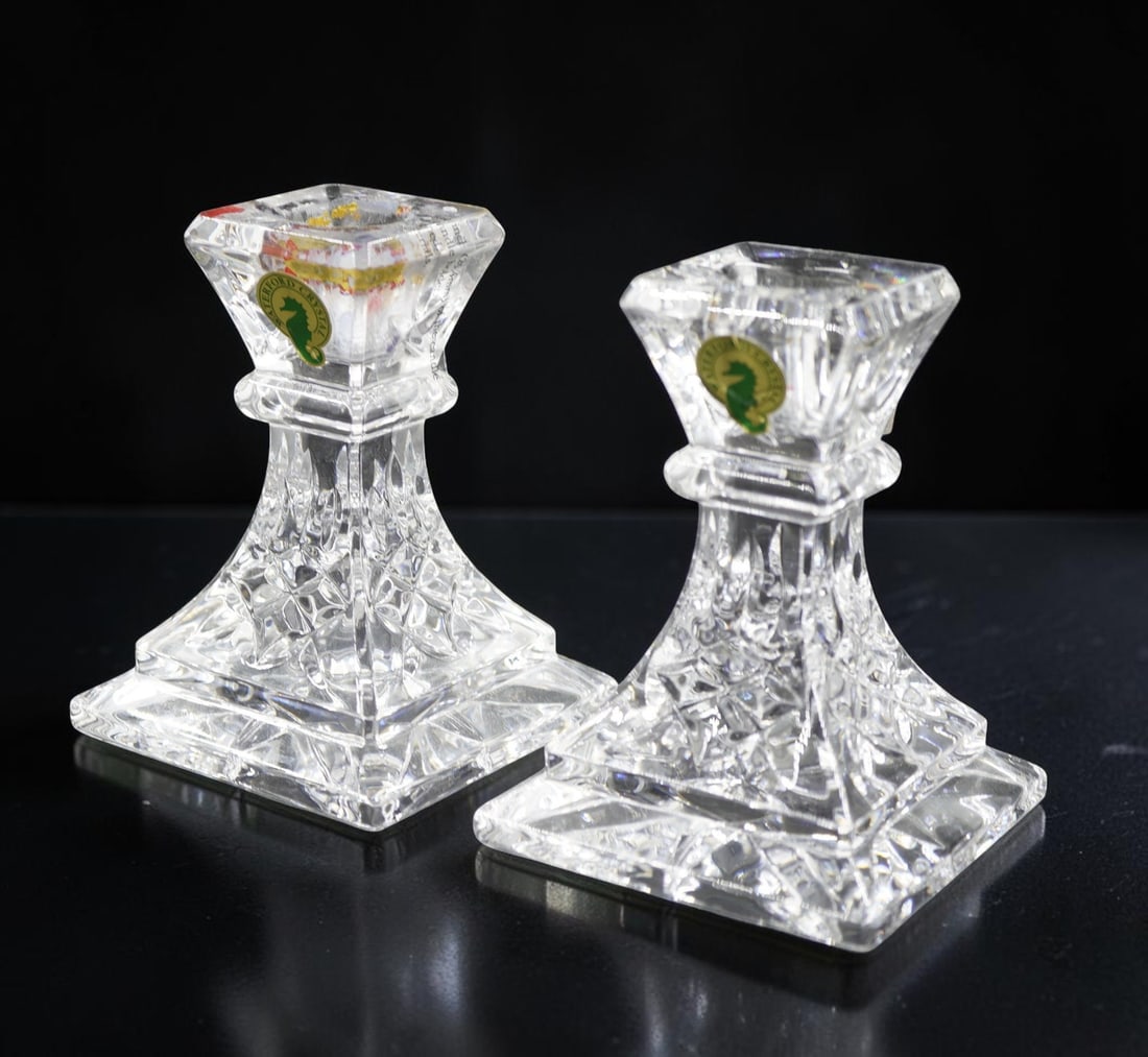 PAIR OF WATERFORD LISMORE CANDLESTICKS IN ORIGINAL PACKAGING: Pair of Waterford 4" Lismore Candlesticks in Original Orange Tube/Packaging. Total lot weight is approx. 2 lbs 8 oz. . **In house shipping available on this lot** If you win this lot, please select