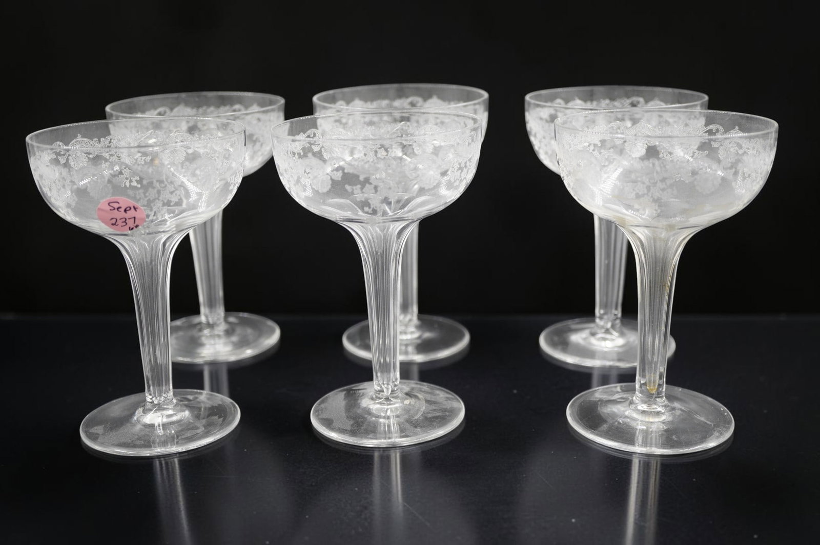 6 VINTAGE ETCHED TALL HOLLOW STEM CHAMPAGNES: 6 Vintage Elegant Etched Tall Hollow Stem Campagne Glasses. Each 3 1/2"xxx5 1/4". Weight on all 1 lb 4 oz. Provenance:16 Water Street, a beautifully appointed home, circa 1815, located in the heart
