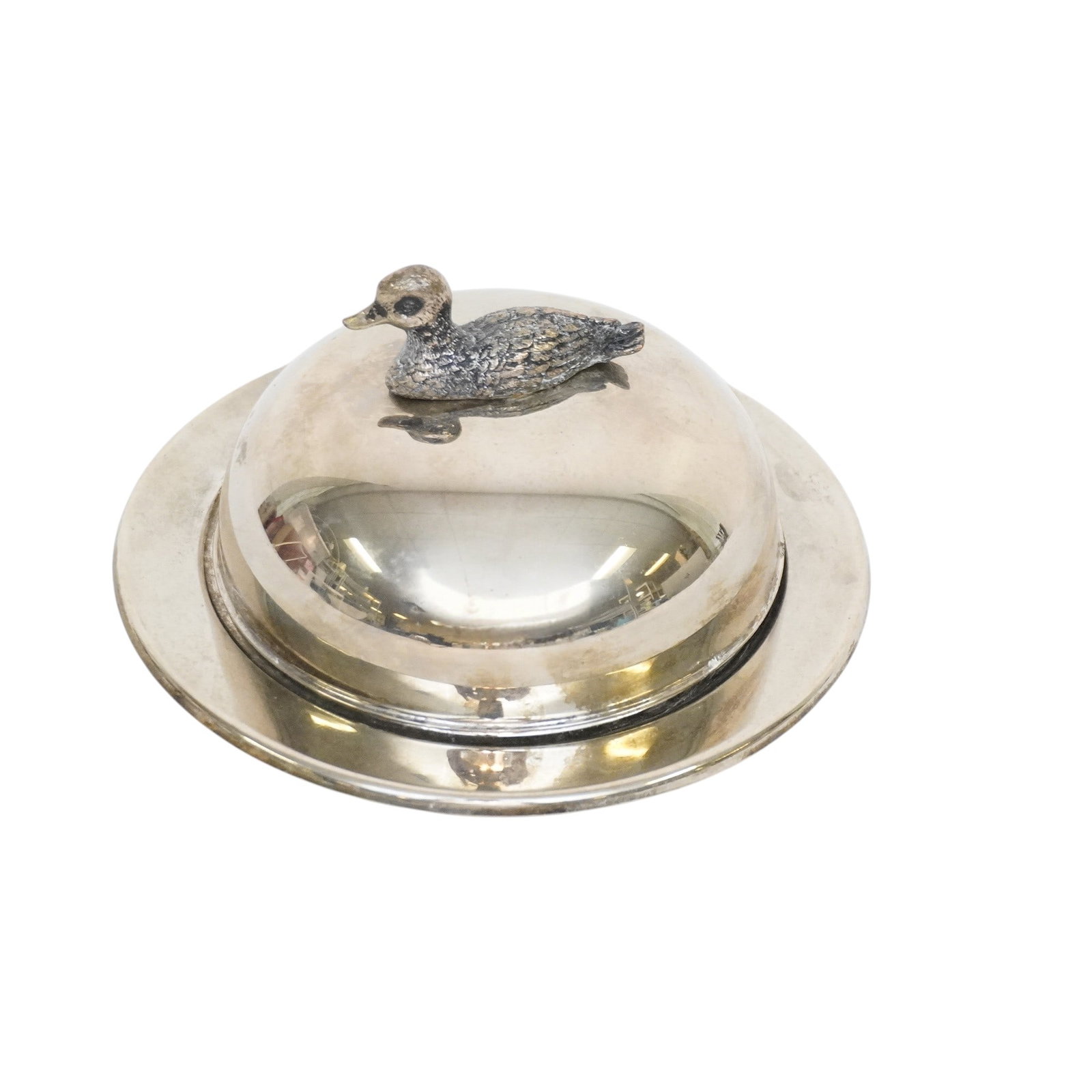SILVER PLATED COVERED DUCK BUTTER DISH: Silver Plated Covered Duck Butter Dish with Glass Insert. Measures approx. 5.25" in dia. x 2" and weighs 12 oz. . **In house shipping available on this lot** If you win this lot, please select self