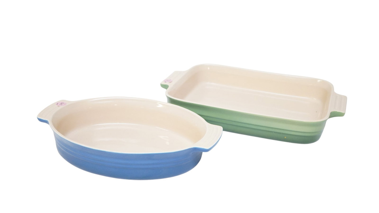 2 LE CRUSET STONEWARE CASSEROLE DISHES: 2 Le Cruset Stoneware Casserole Dishes. Larger measures approx. 15" x 10" x 2.5" and total lot weight is 7 lbs 11 oz. Provenance:16 Water Street, a beautifully appointed home, circa 1815, located in t