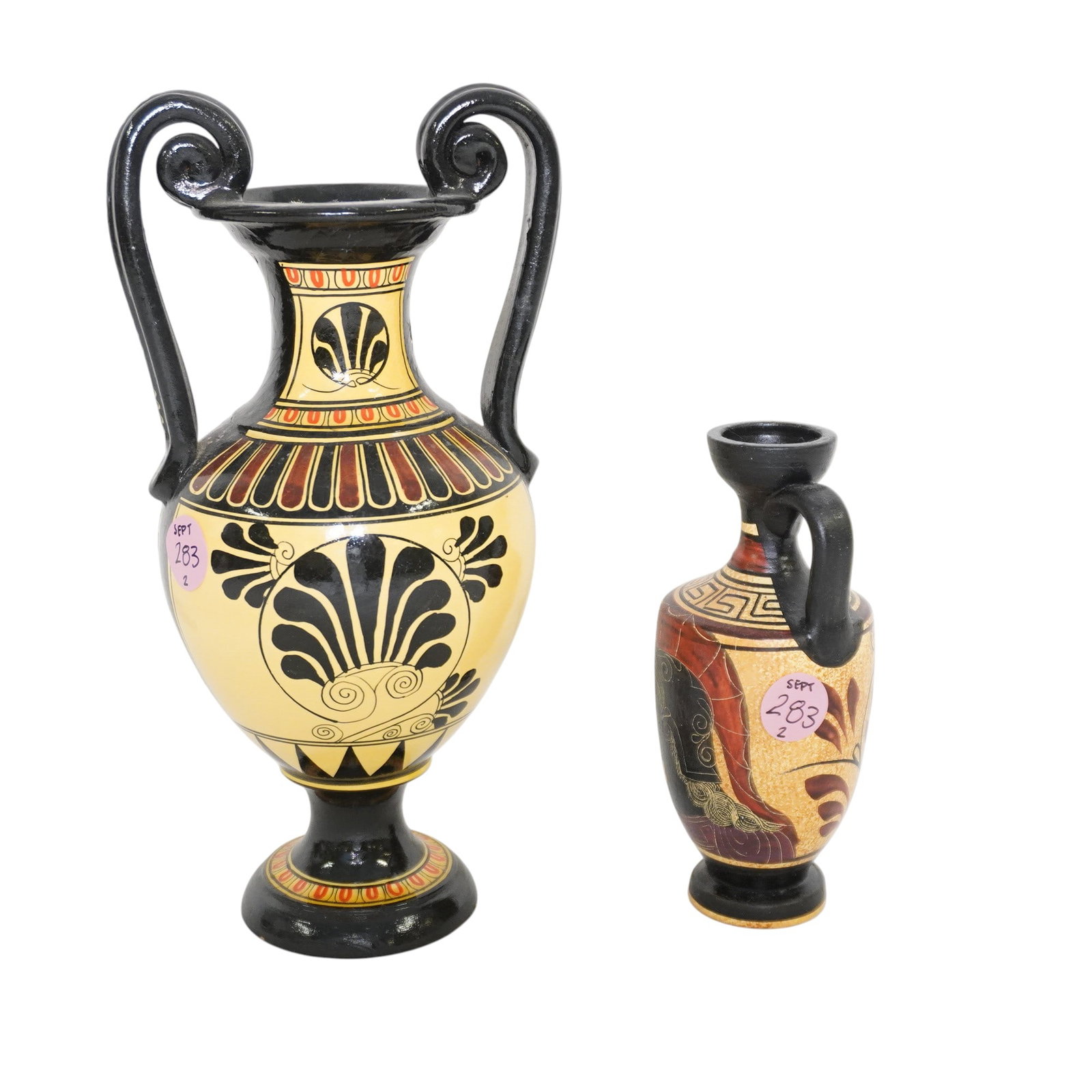 PAIR OF HANDPAINTED GRECIAN URNS: Pair of Handpainted Grecian Urns. Larger measures approx. 9" x 4 x 3.5" and weighs 1 lb 5 oz. . **In house shipping available on this lot** If you win this lot, please select self arranged for in hous