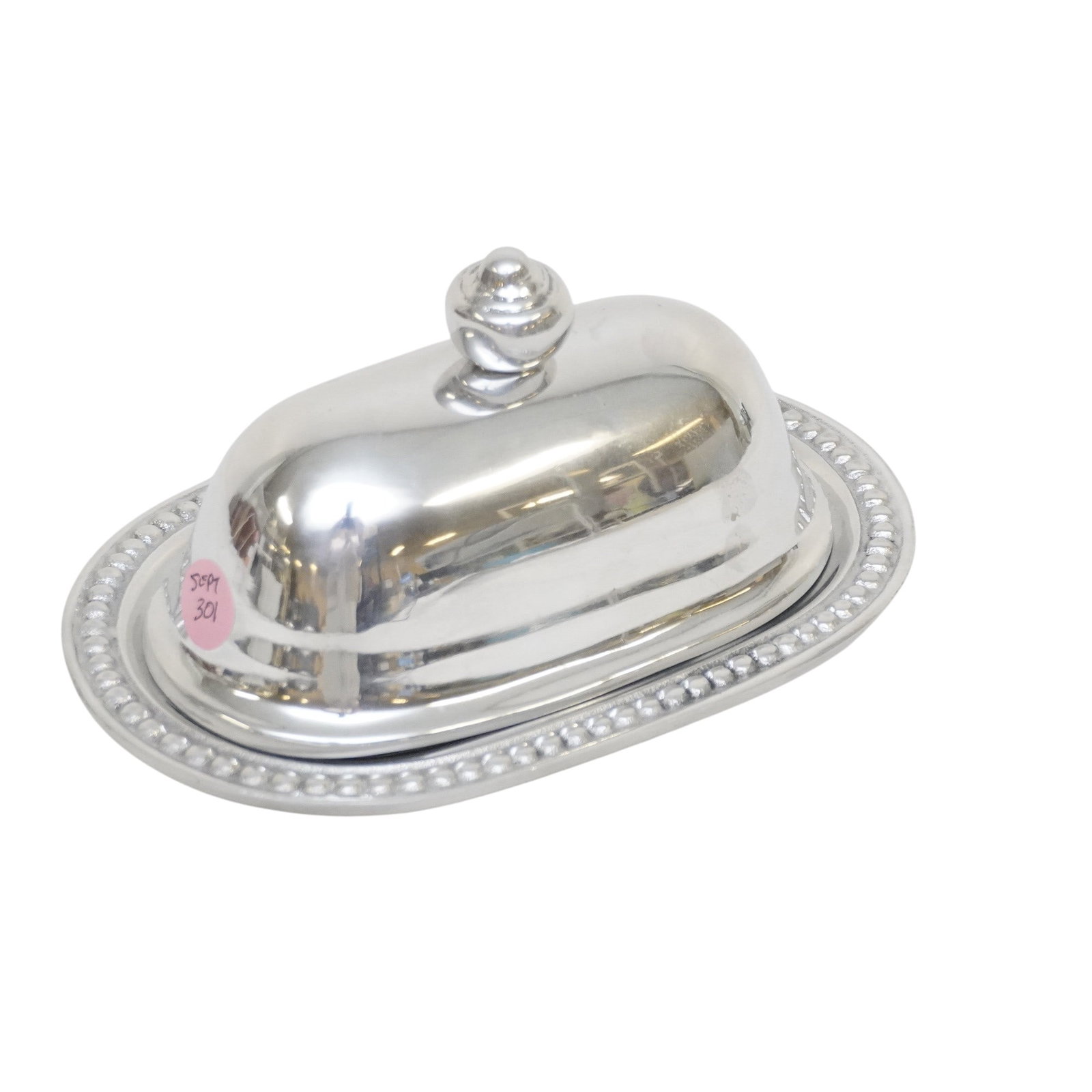 POLISHED ALUMINUM BEATRIZ BALL BUTTER DISH: Polished Aluminum Beatriz Ball Butter Dish. Measures 8"x5"x4 1/2:. Weight 1 lb 5 oz. PROVENANCE The Historic R.M. Venning House, Charleston SC **In house shipping available on this lot** If you win th