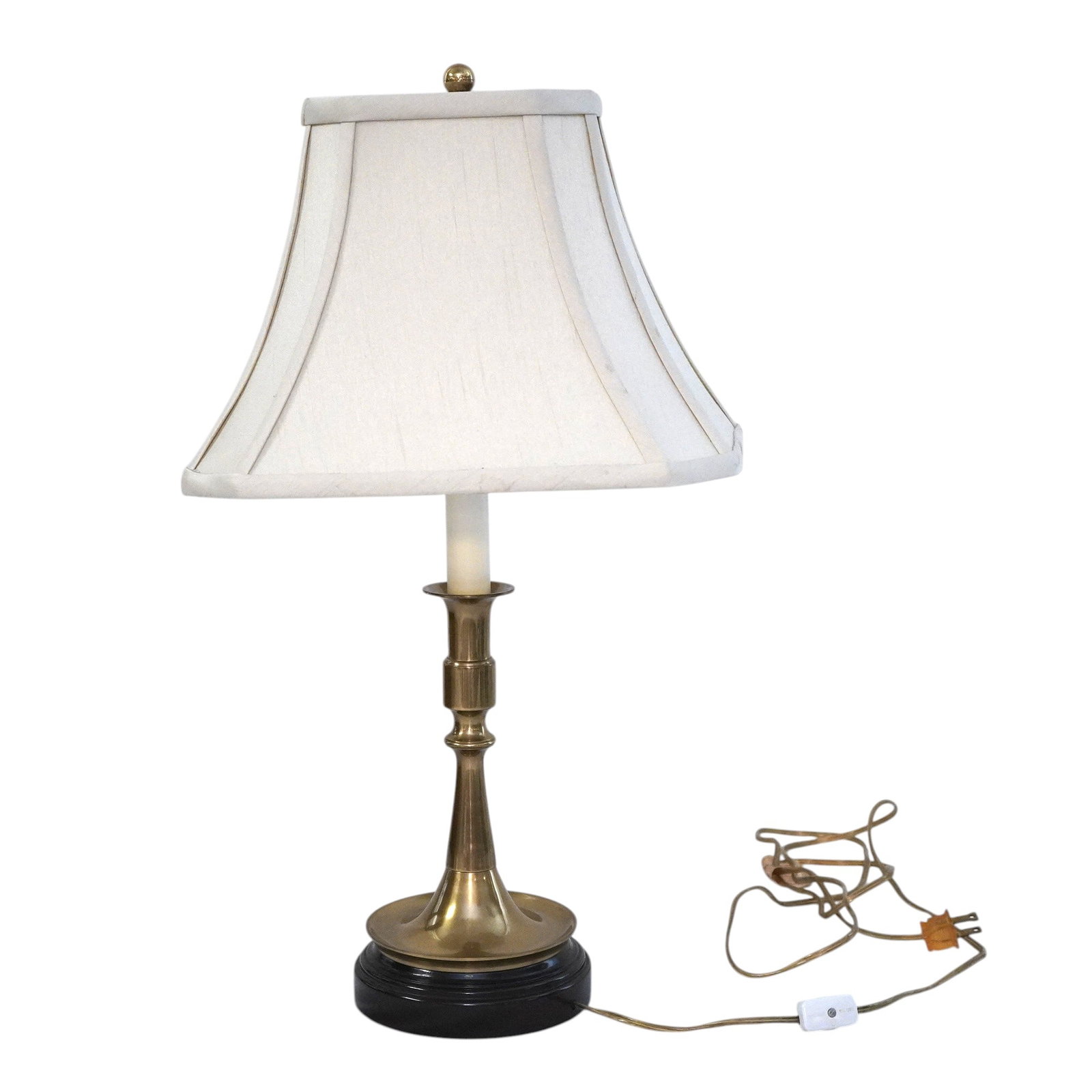 VINTAGE QUALITY BRASS CANDLESTICK LAMP: Vintage good quality brass candlestick lamp and shade. Possibly Baldwin. Just lamp 5 1/2"x16". To top of finial 21". Shade 12 1/2"x9"x8 1/2", Weight 4 lbs 6 oz Provenance:16 Water Street, a beautifull
