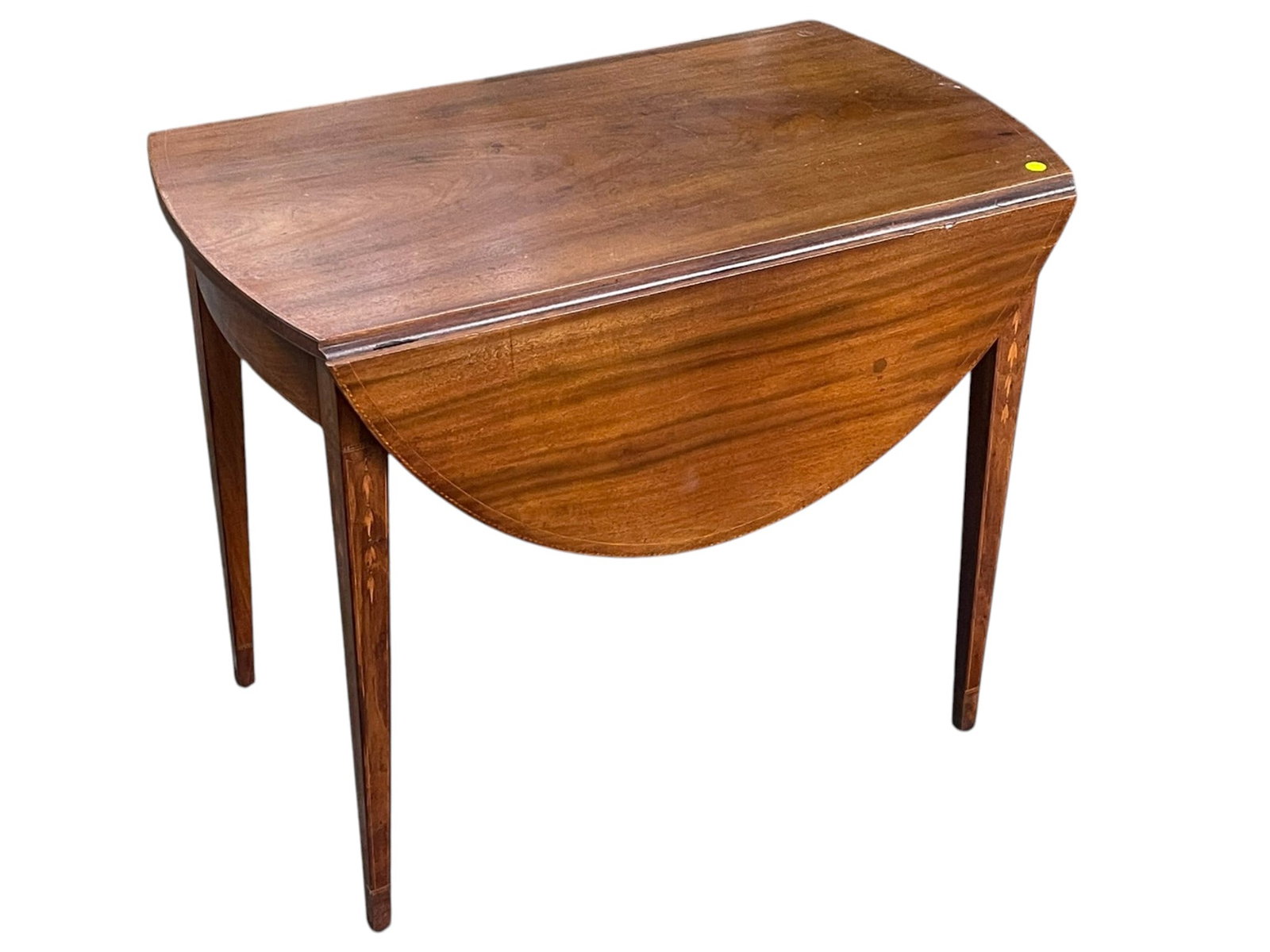 AMERICAN FEDERAL INLAID MAHOGANY PEMBROKE TABLE: American Federal Inlaid Figured Mahogany Drop Leaf Pembroke Table.Graceful bellflower fruitwood inlay on tapered legs, inlaid stringing to top. Measures 34"x19"x28". Each leaf 12". Opened top is 43". 
