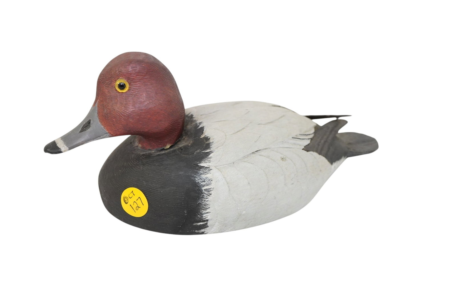 CARVED REDHEAD DRAKE DECOY BRENNAN 1976: Hand Carved and Painted Redhead Drake Decoy with Glass Eyes signed Brennan and dated 1976. . Measures 12 oz 9"x4 1/4x4 1/2". Provenance: Gippy Plantation, Avenue of Oaks, Berkeley County, SC. **In hou