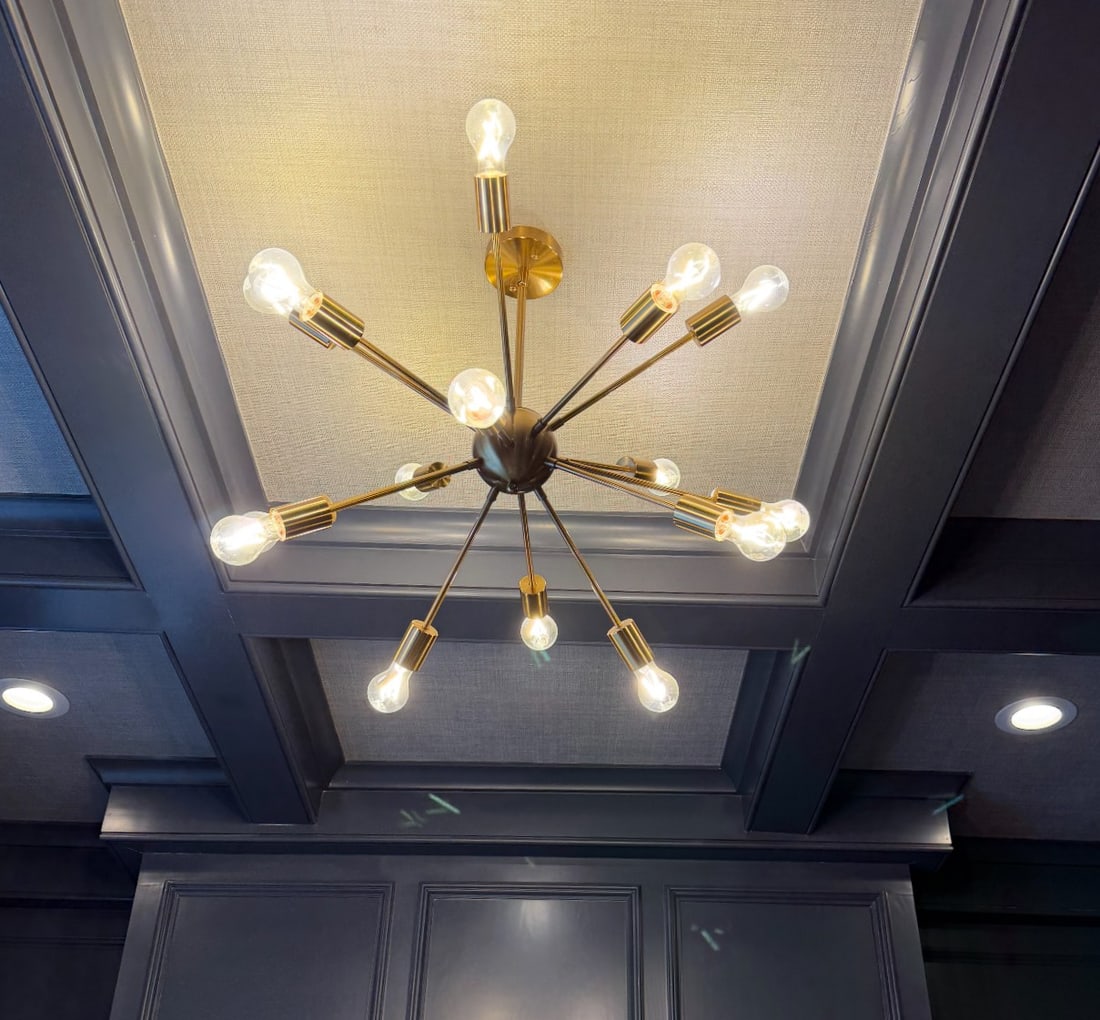 CONTEMPORARY 14- LIGHT BRUSHED BRASS SPUTNIK CHANDELIER: Contemporary mid-century modern style Sputnik brushed brass-tone finished 14 arm chandelier. Approximately 35" with a 5" diameter central sphere. Weighs approximately 8 lbs.**In house shipping availab