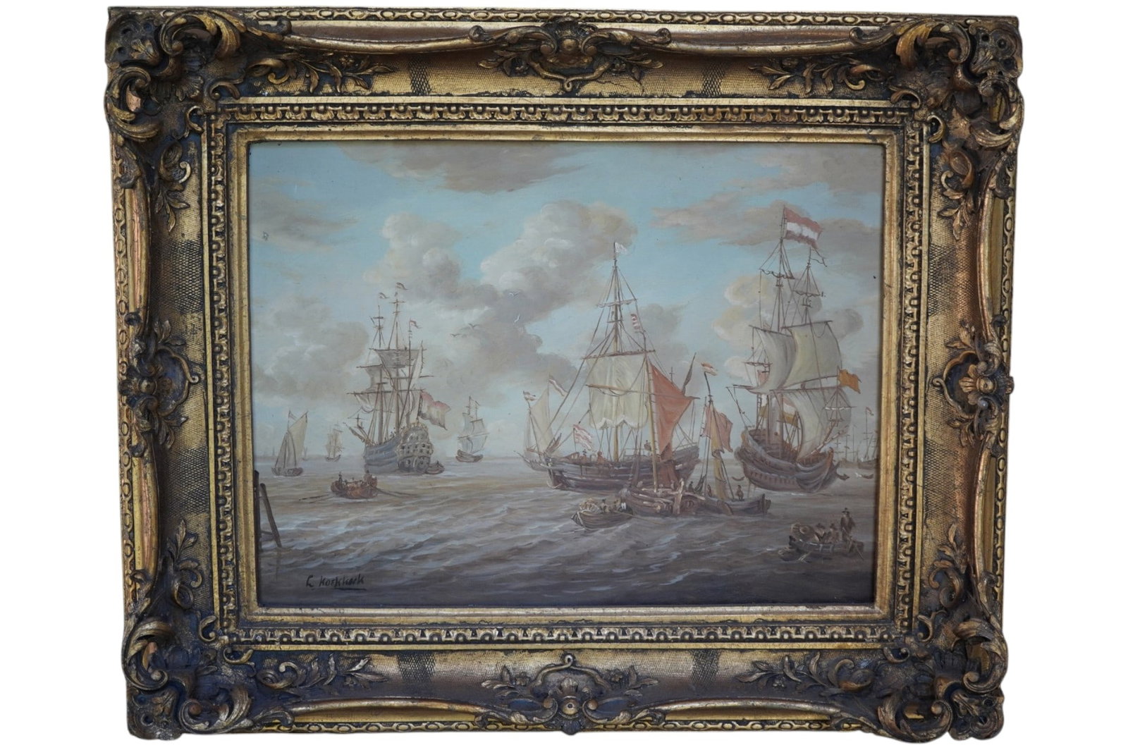 DUTCH MARITIME EAST INDIA COMPANY SHIPS OIL IN ANTIQUE FRAME: Early 20th c Dutch Golden Age Style Maritime Seascape with V.O.C. Vereenigde Oostindische Compagnie, the Dutch East India Company Ships. Signed L. Koekkoek. Oil on Panel. In ornate carved gilt and ges