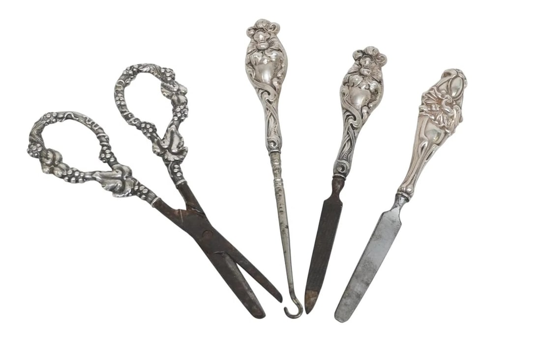 4 pc STERLING SILVER ART NOUVEAU VANITY +: 4 Art Nouveau Sterling Handle Vanity Items & Grape Shears. Button Hook 7" Grape Shears 6 1.2". Fikes 6 1/4". Weight on all 6 oz. **In house shipping available on this lot** If you win this lot, please